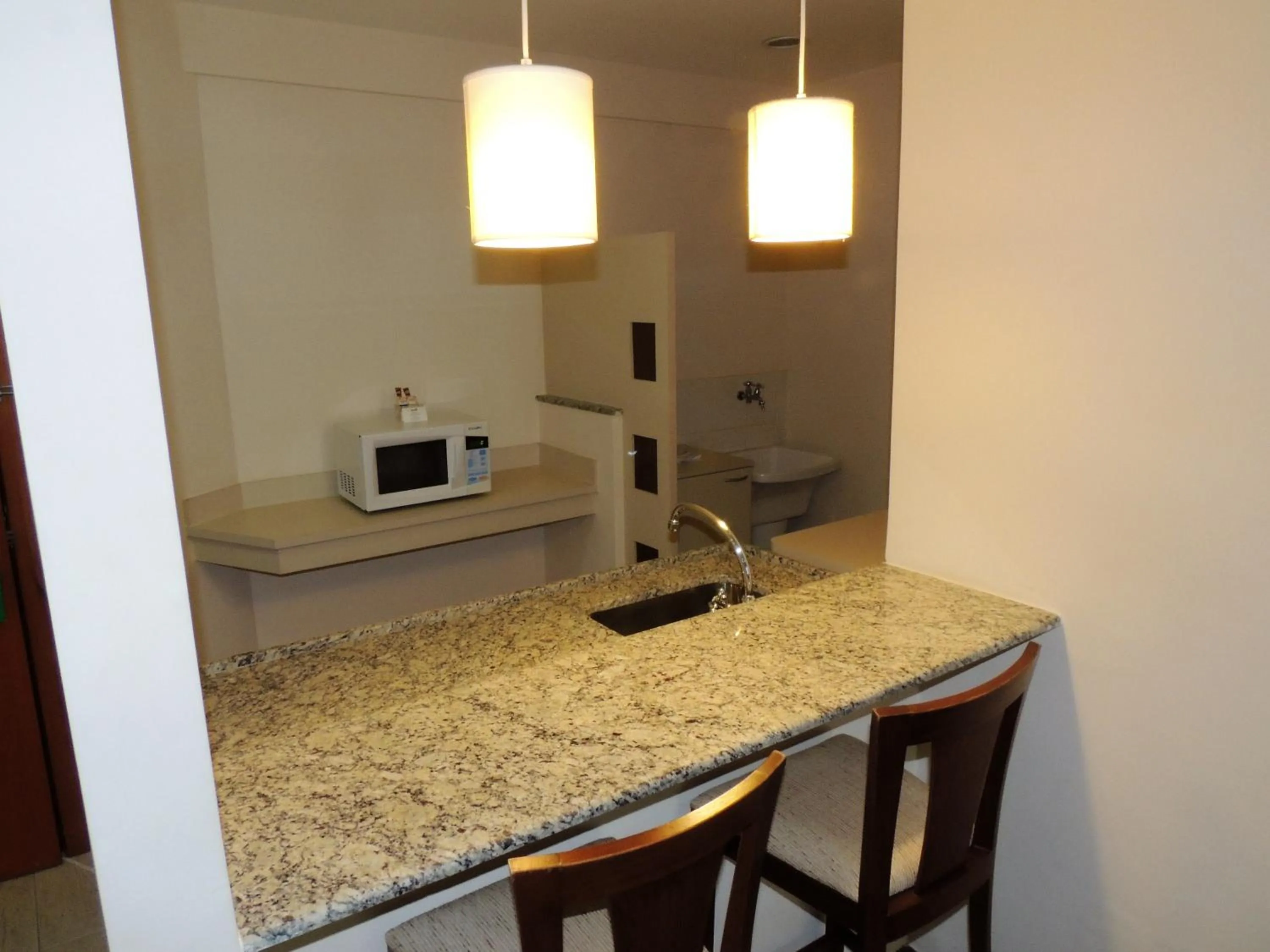 Kitchen or kitchenette in Mondrian Suite Hotel