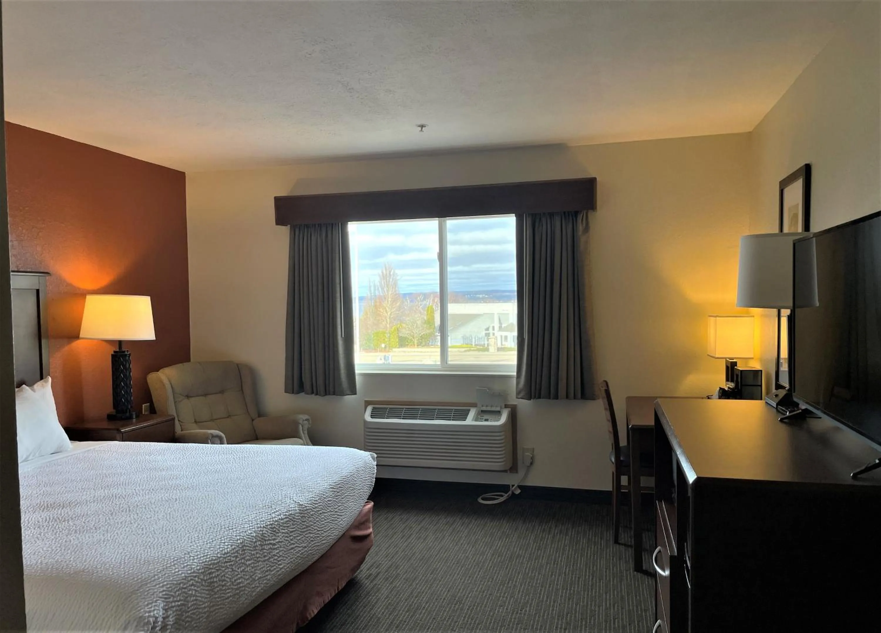 Bed in AmericInn by Wyndham Petoskey