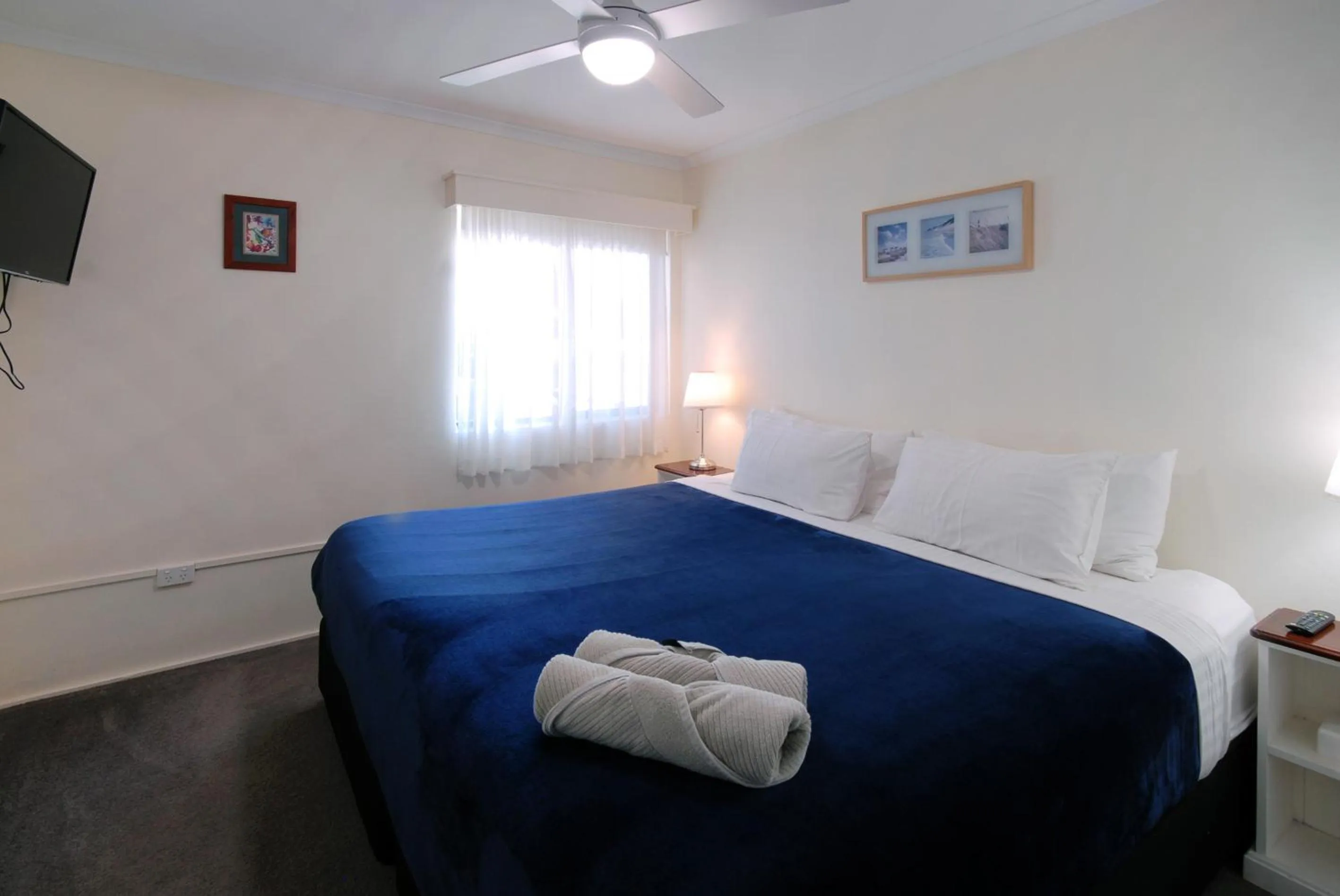 Bed in Marcel Towers Holiday Apartments