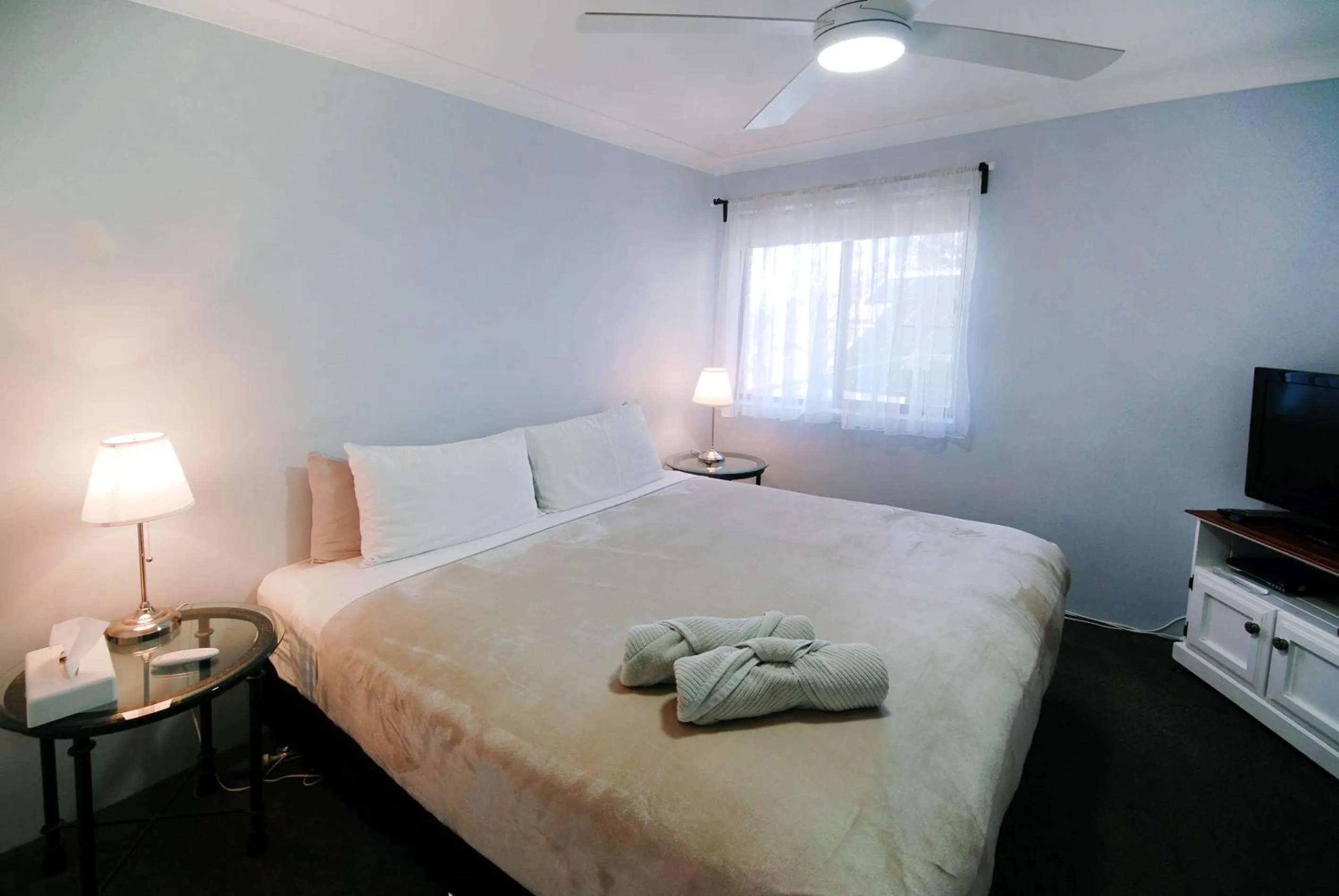 Bed in Marcel Towers Holiday Apartments