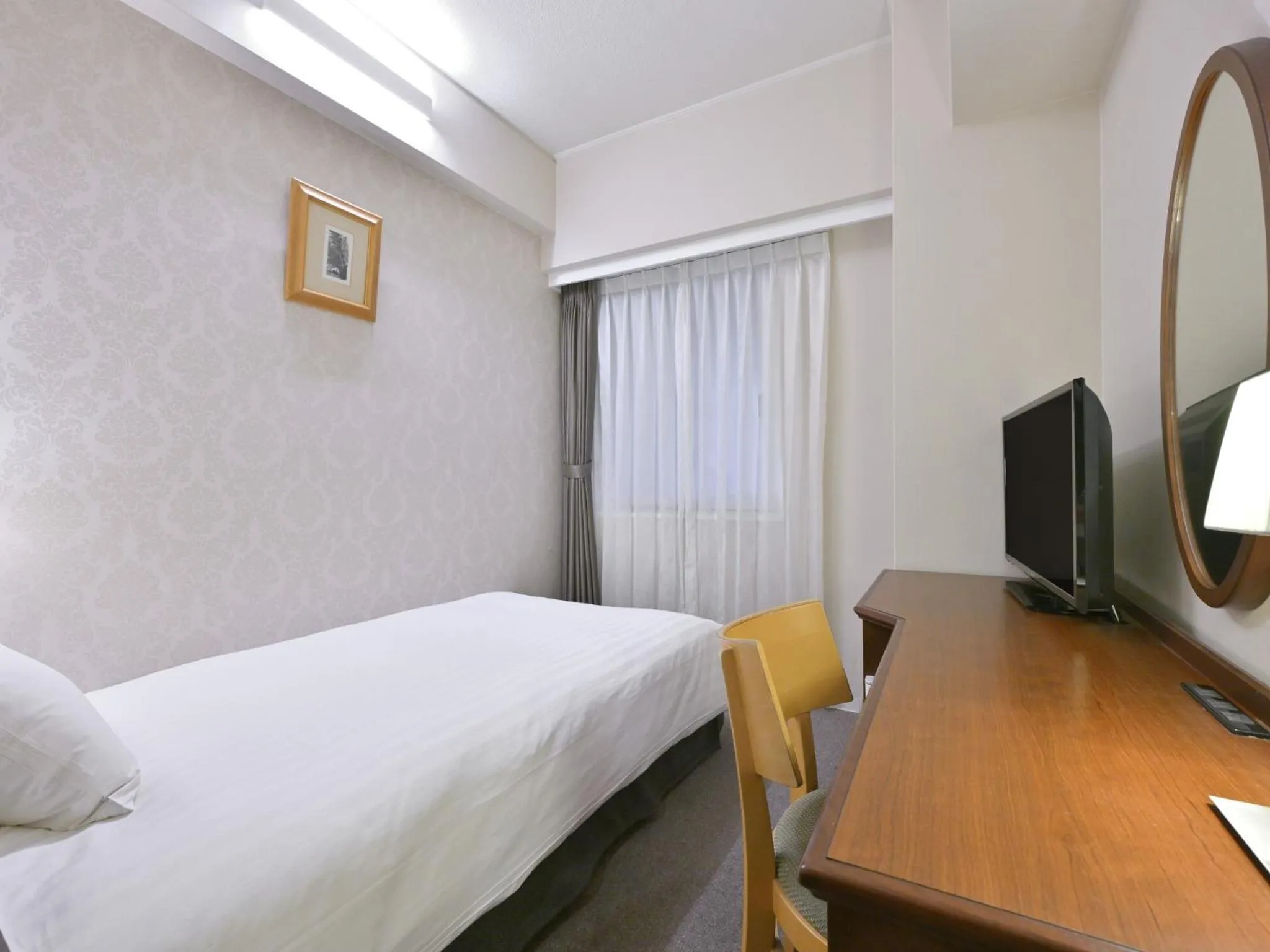 Bed in Rihga Hotel Zest Takamatsu