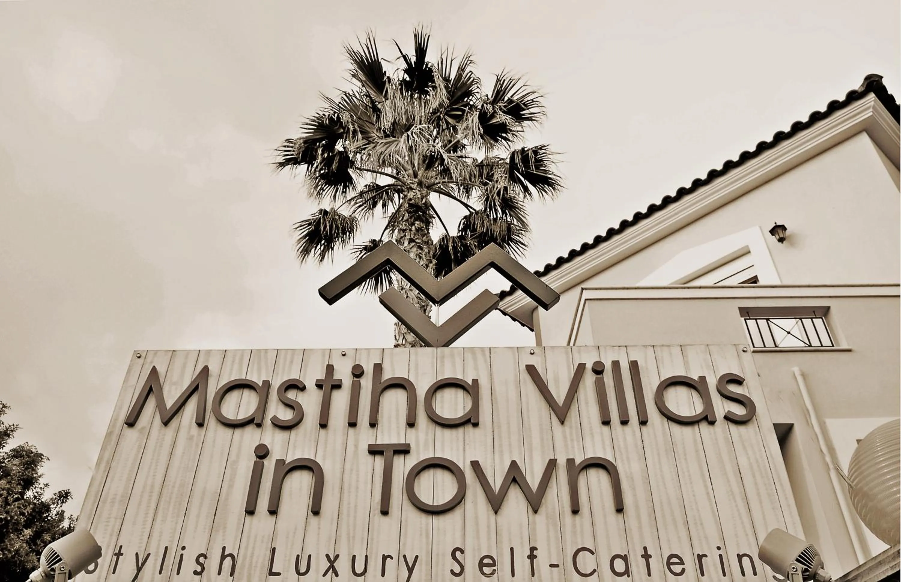 Property logo or sign in Mastiha Villas in Town