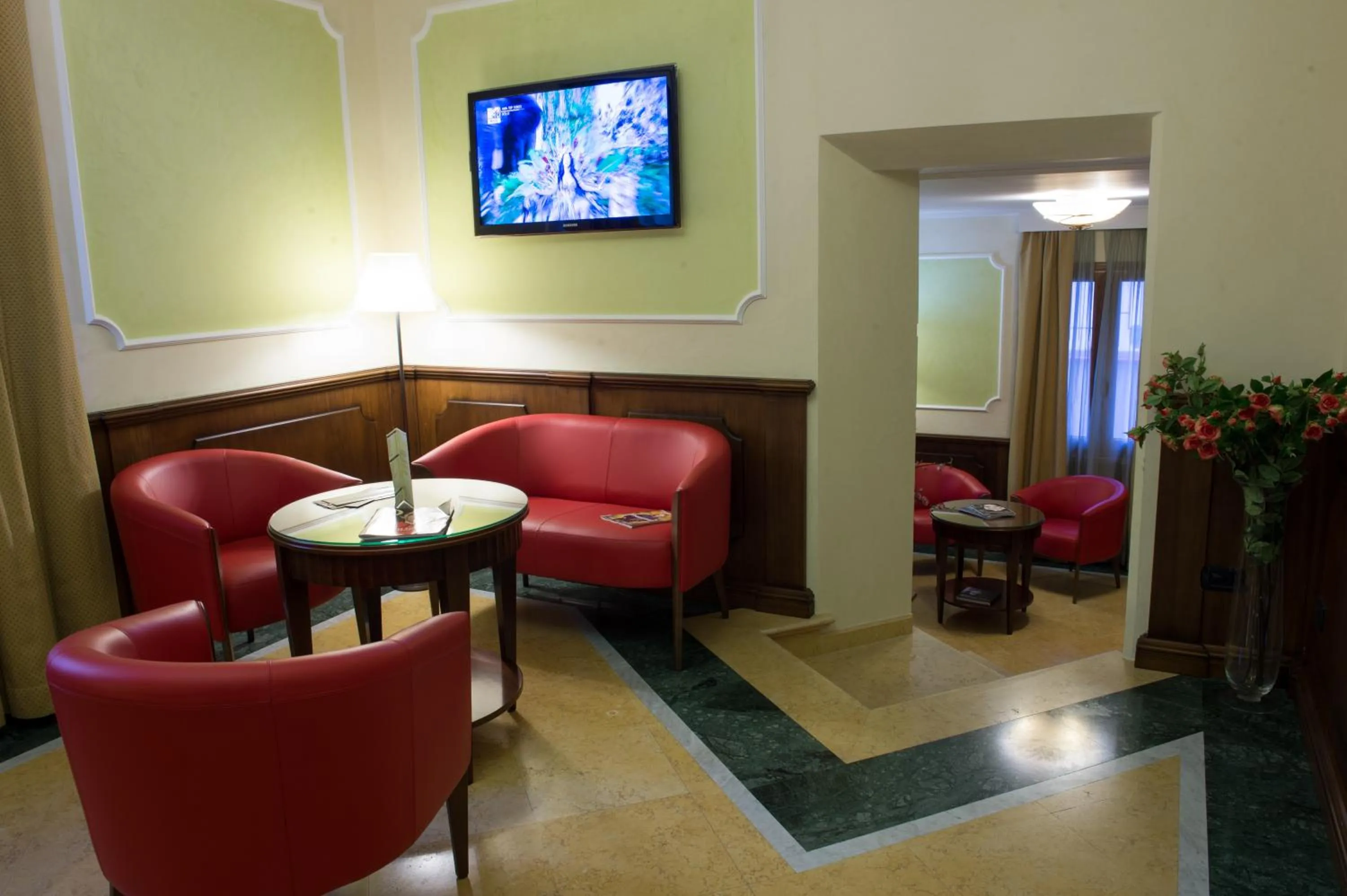 Communal lounge/ TV room in Artemis Hotel