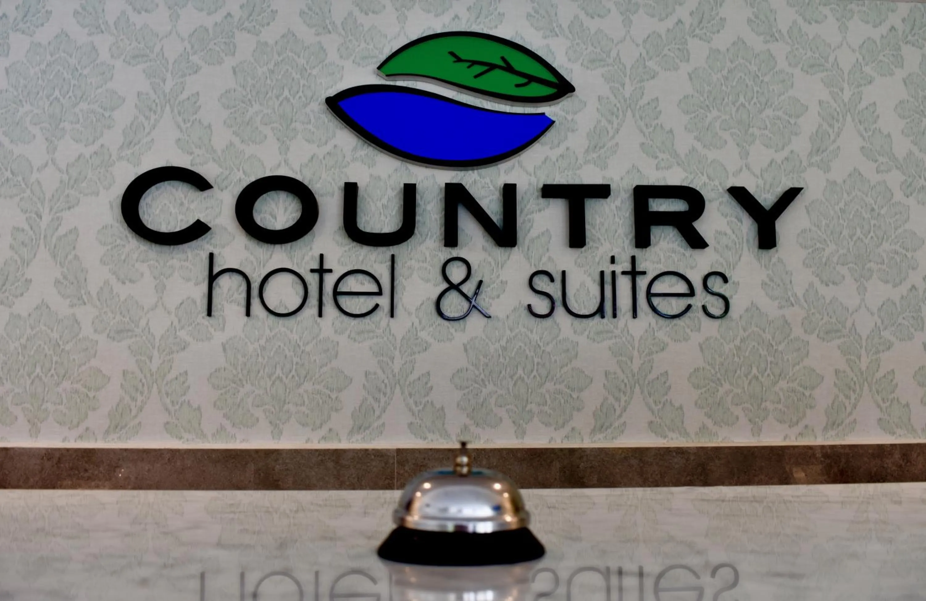 Property logo or sign in Country Hotel & Suites