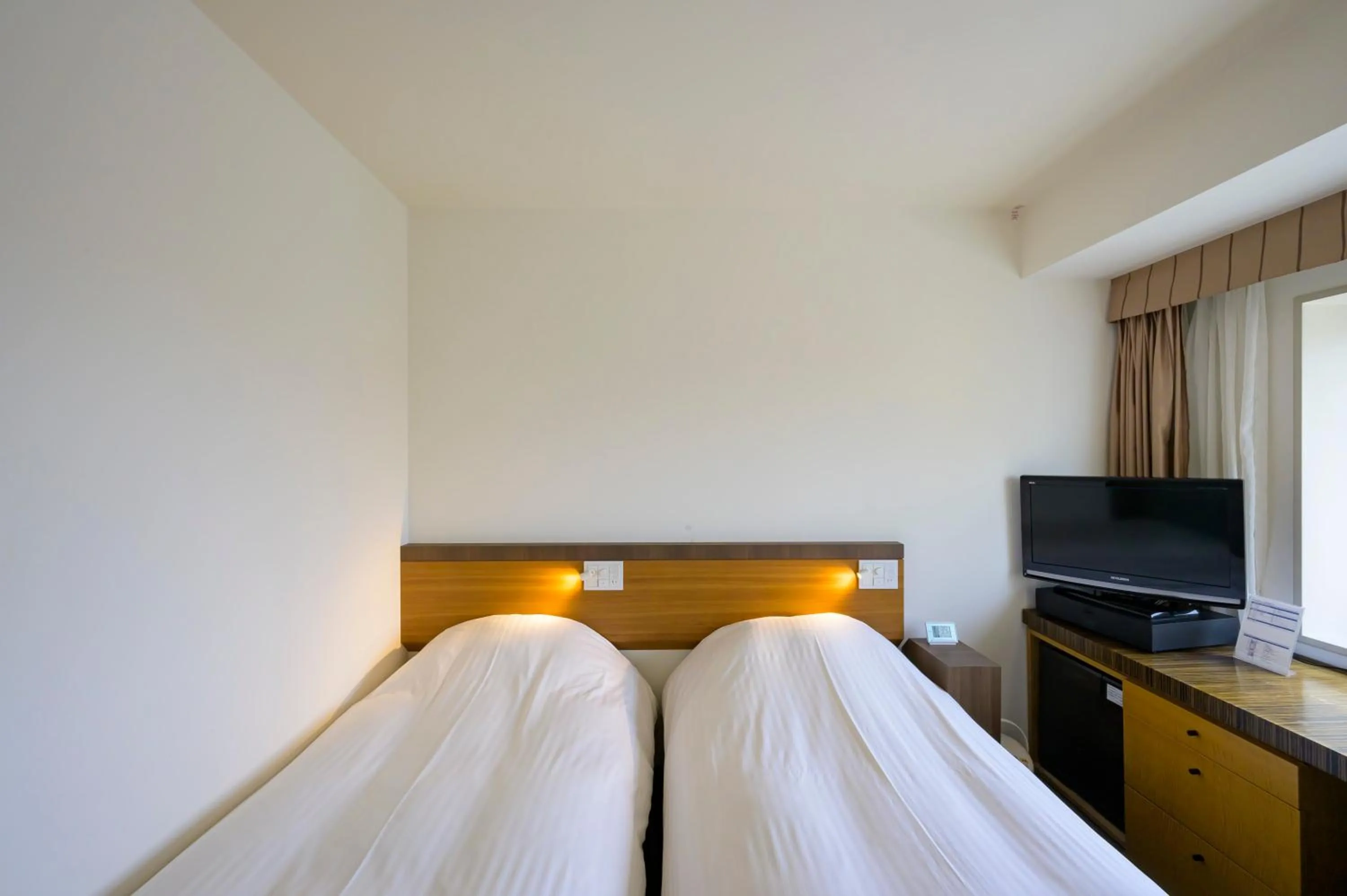 Bed in Twin Leaves Hotel Izumo