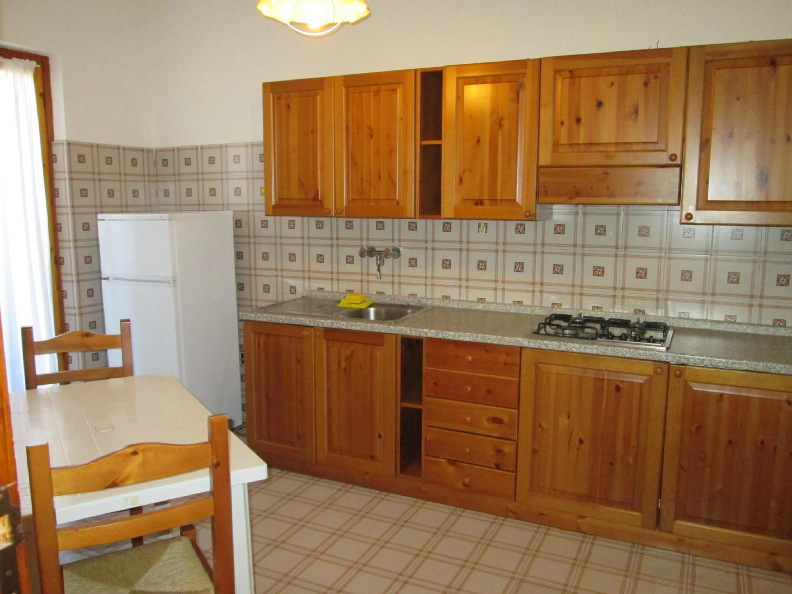 Kitchen or kitchenette in Giannella Appartamenti