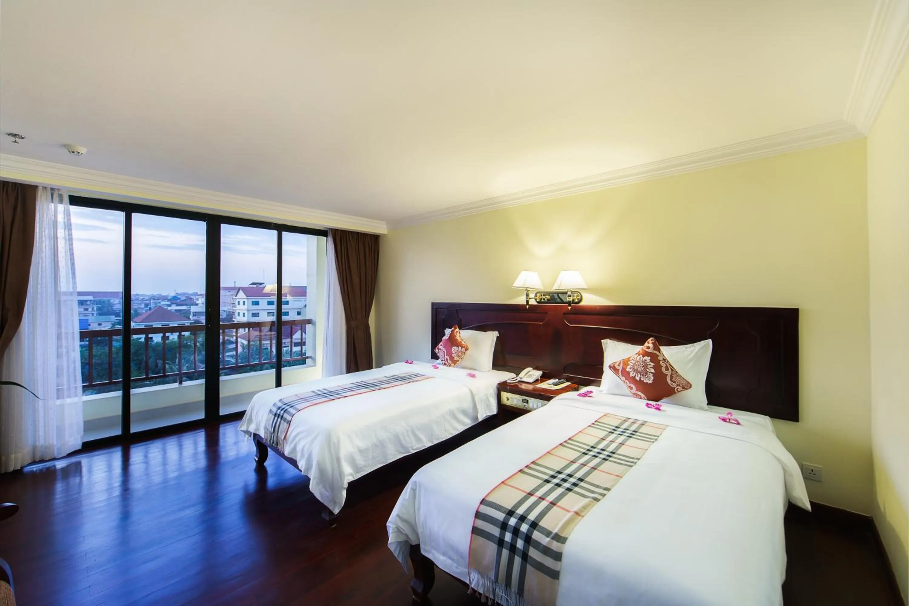 Bed in Smiling Deluxe Hotel