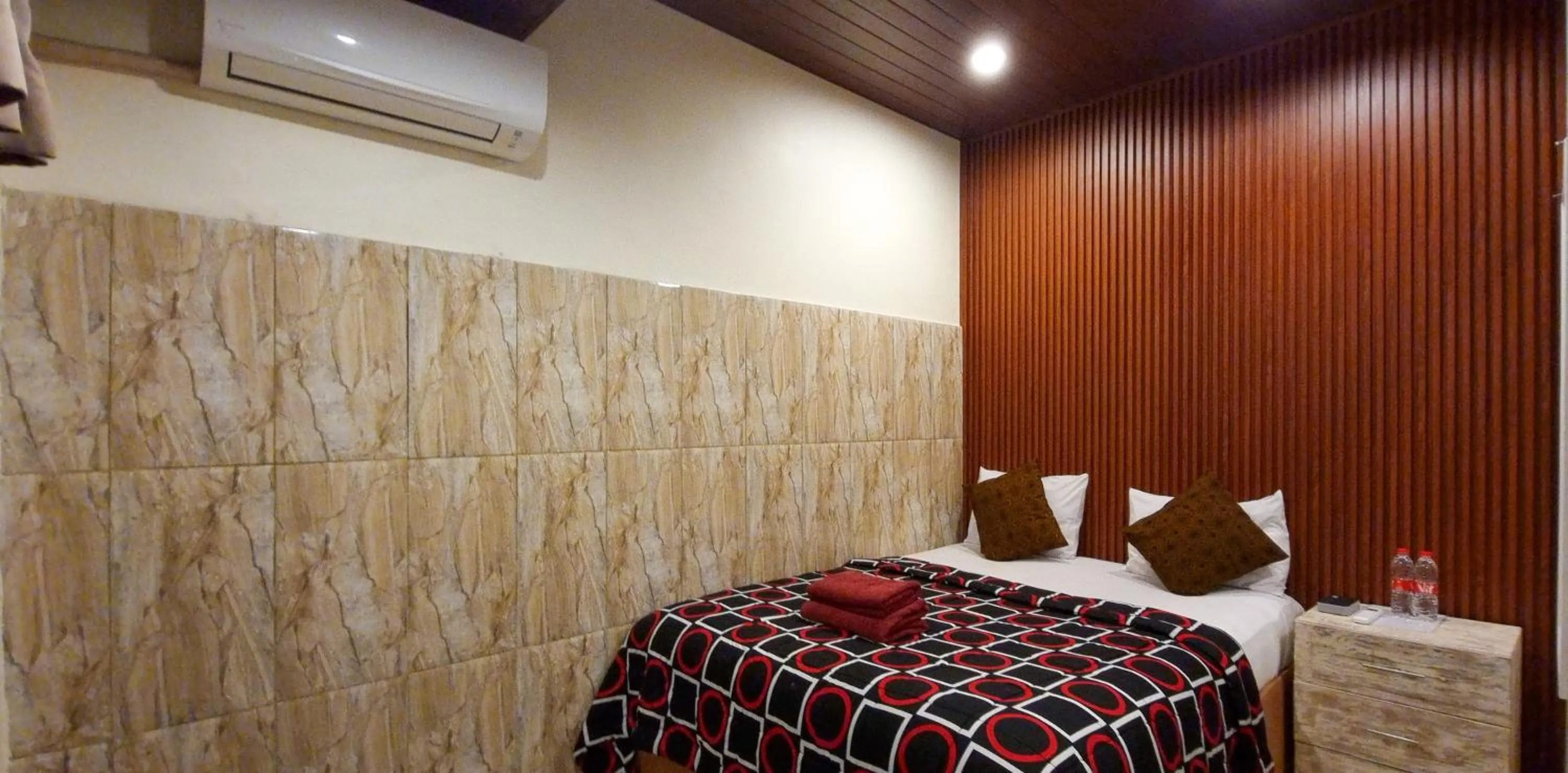 Bed in Gustav Bali Homestay and Massage