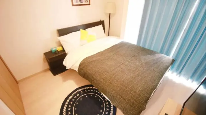 Bed in Uhome Kanda Hotel