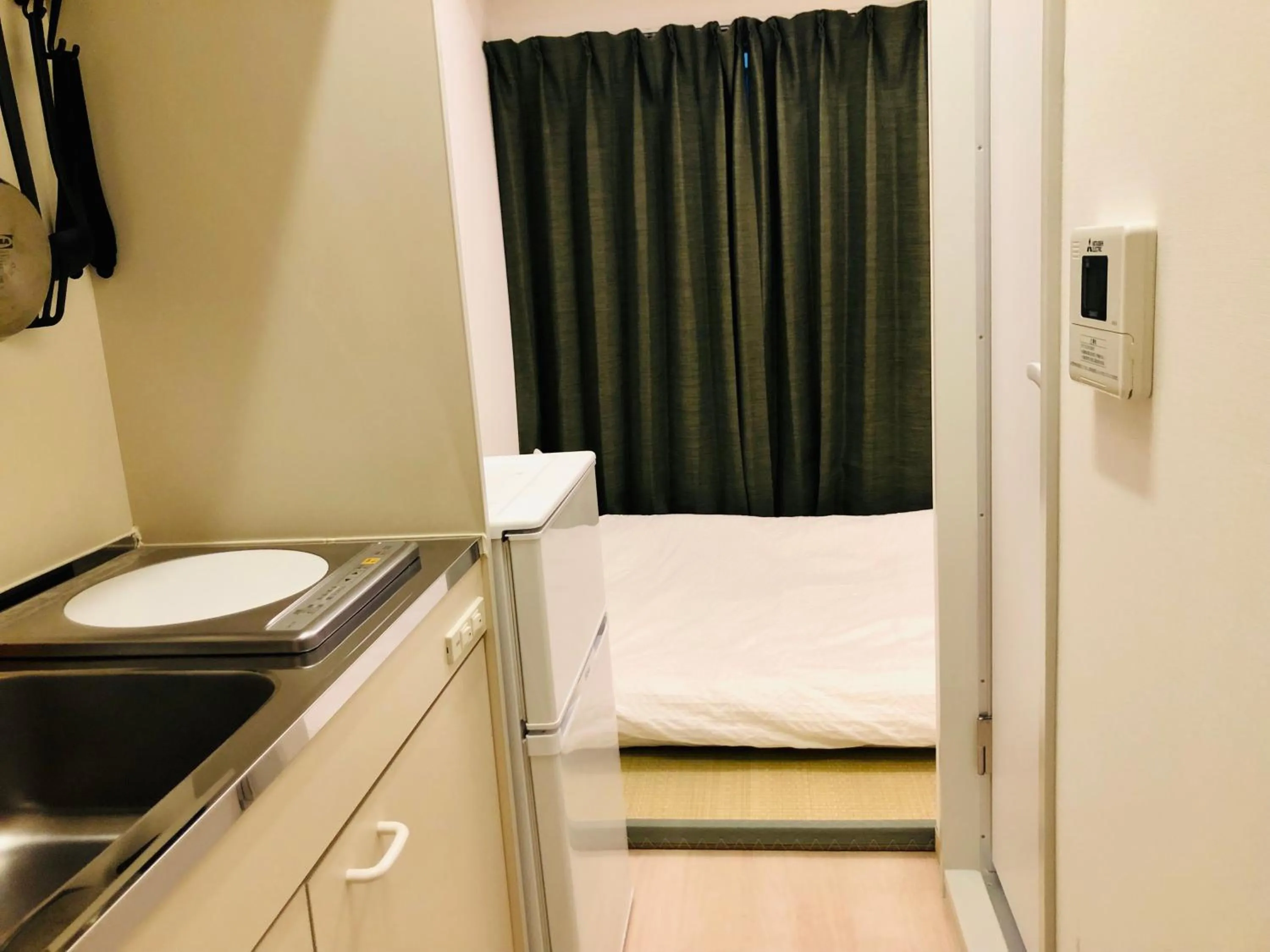 Bed in Uhome Kanda Hotel