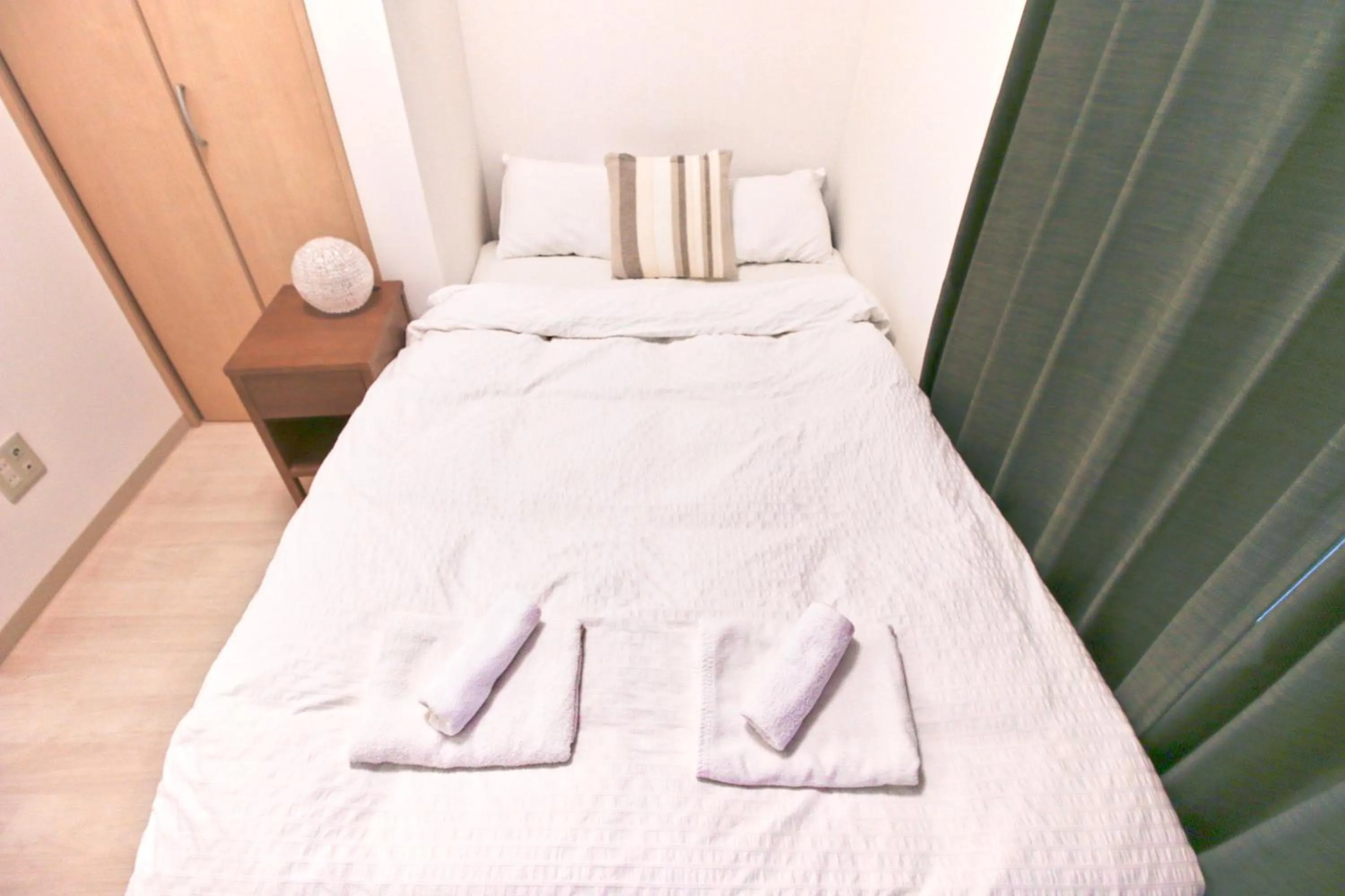 Bed in Uhome Kanda Hotel