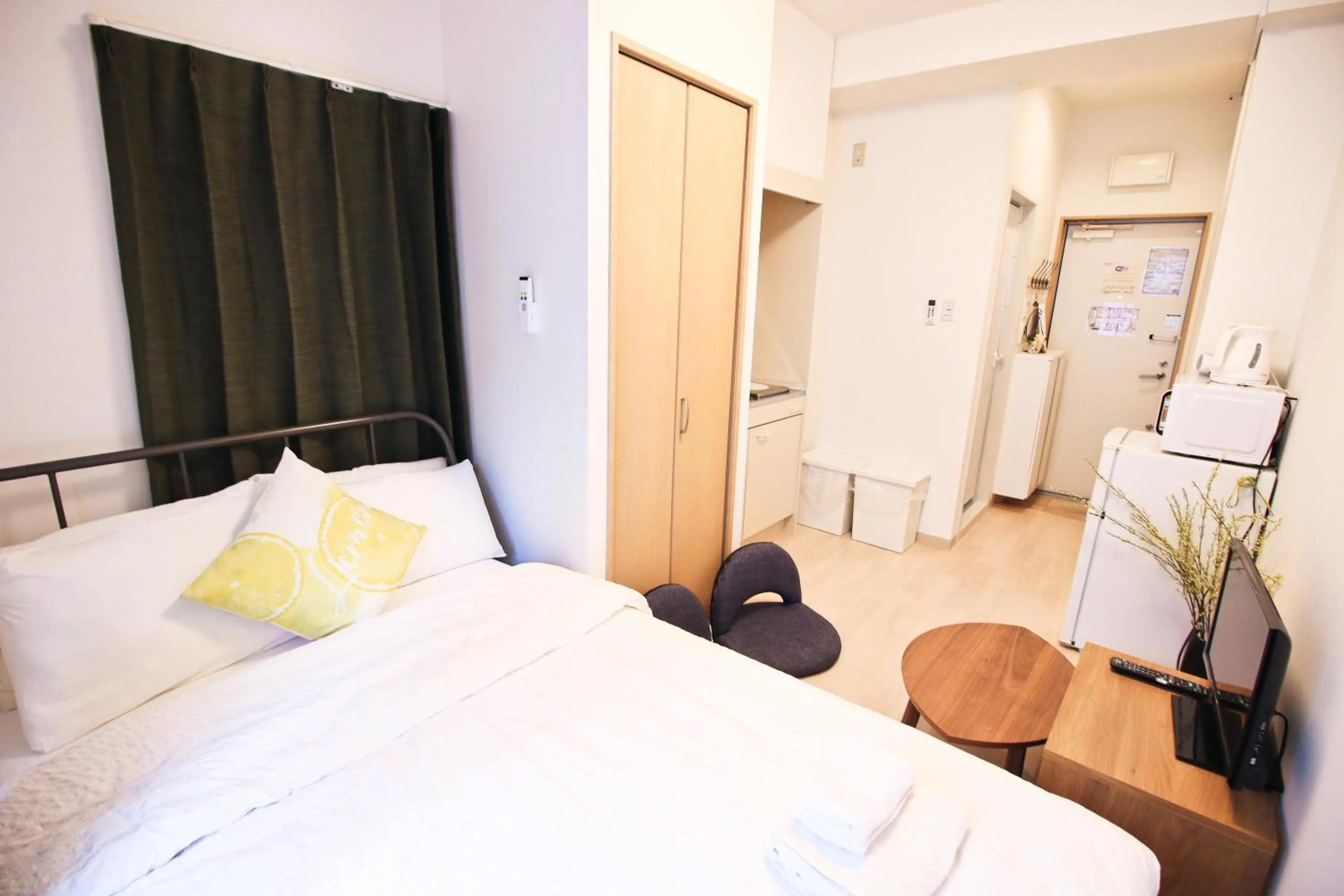 Bed in Uhome Kanda Hotel