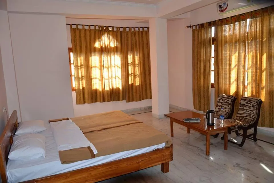 Bed in Hotel Atul Regency