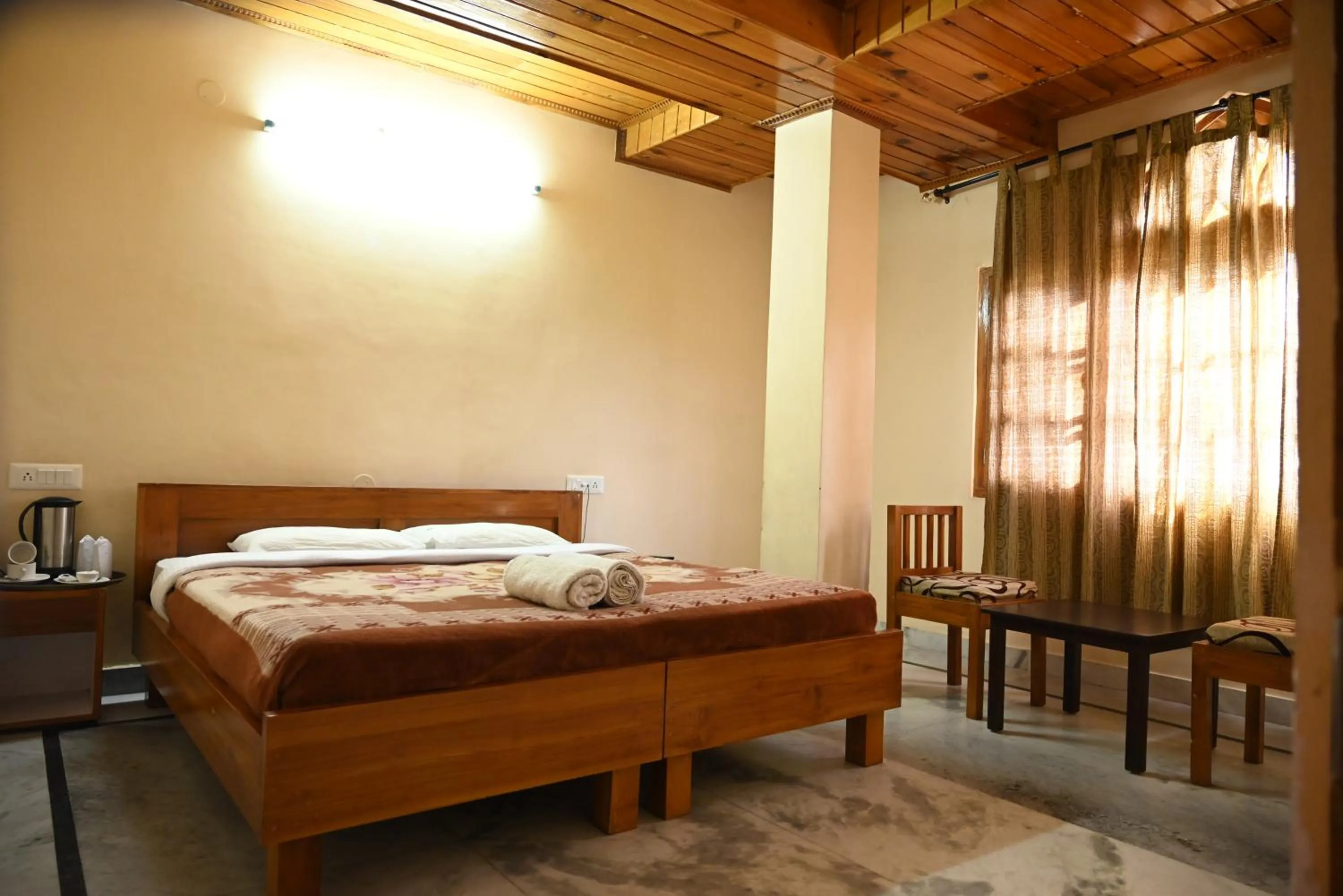 Bed in Hotel Atul Regency