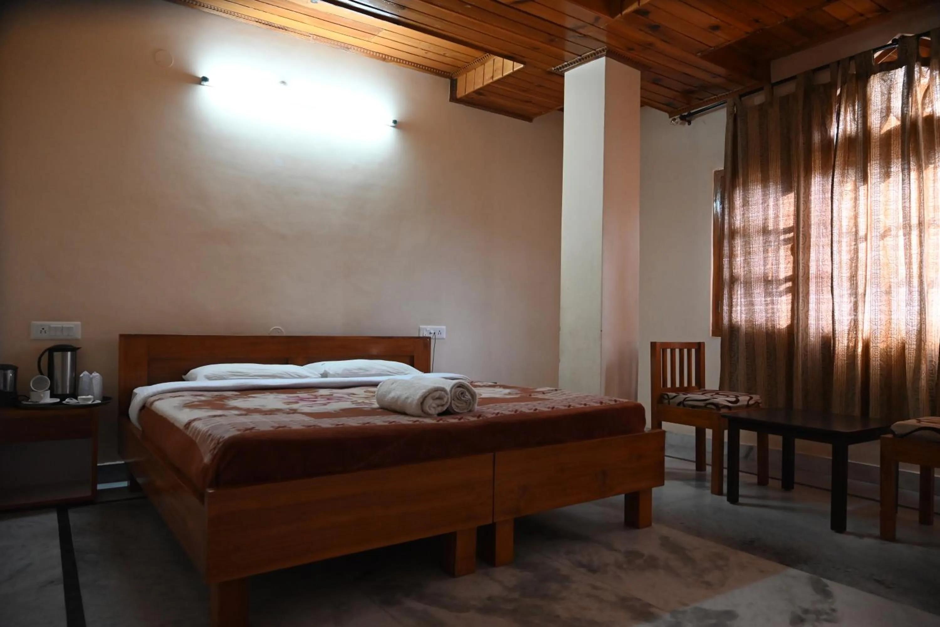 Bed in Hotel Atul Regency