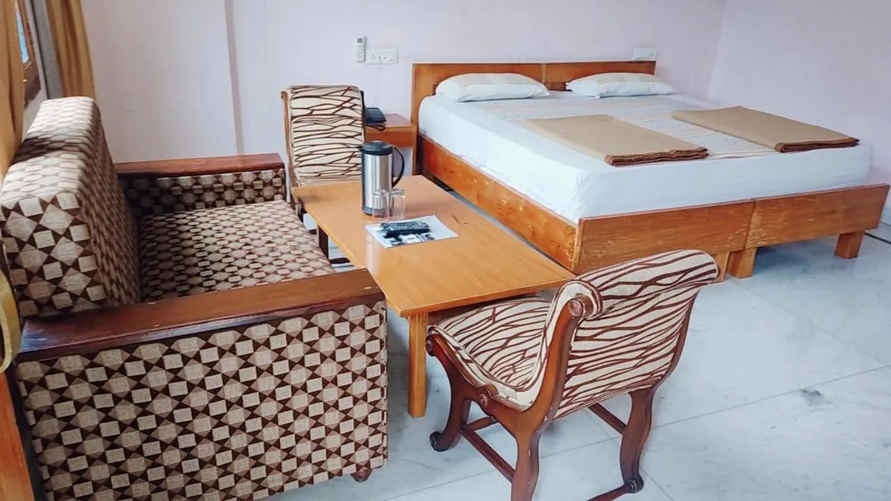 Bed in Hotel Atul Regency