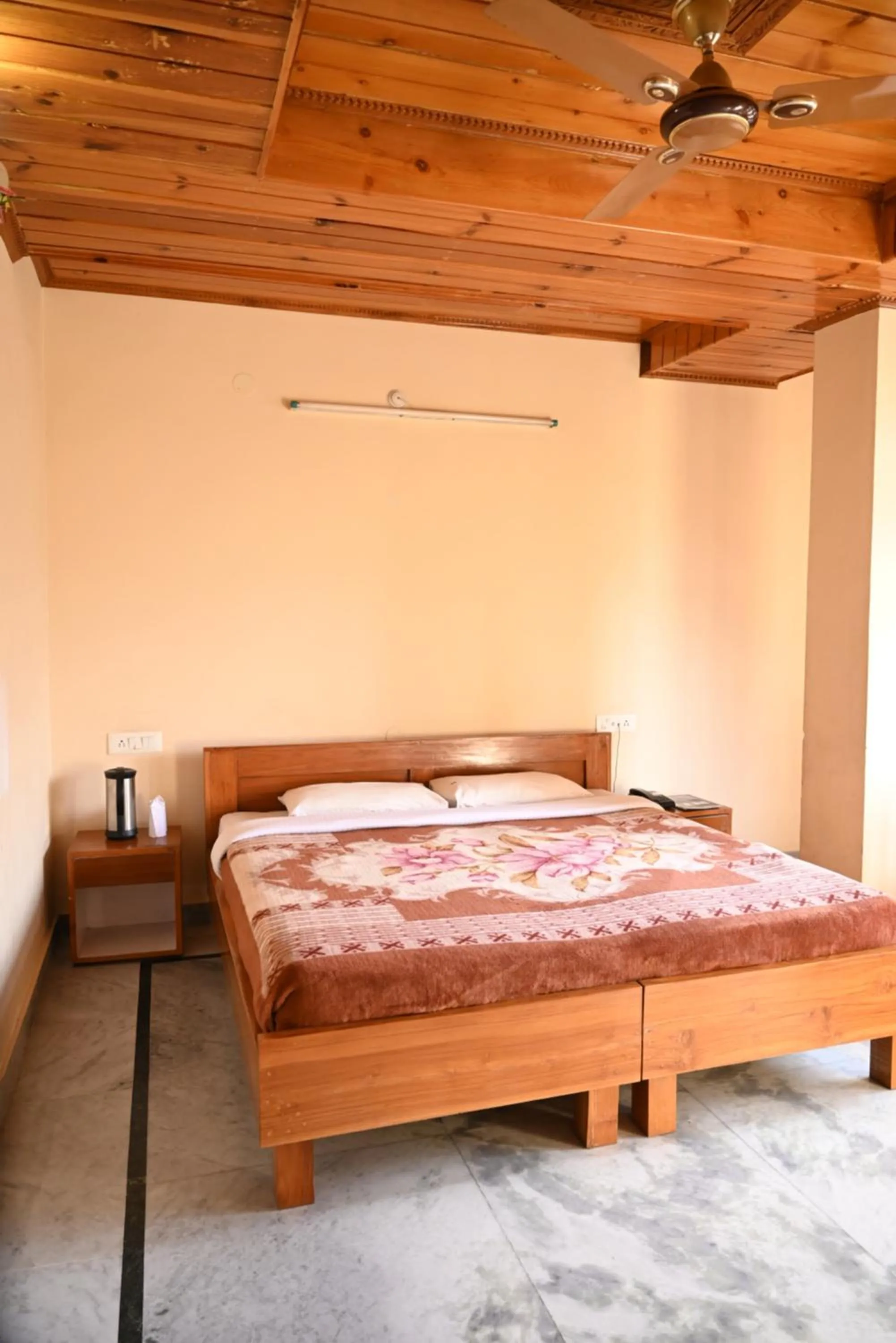 Bed in Hotel Atul Regency