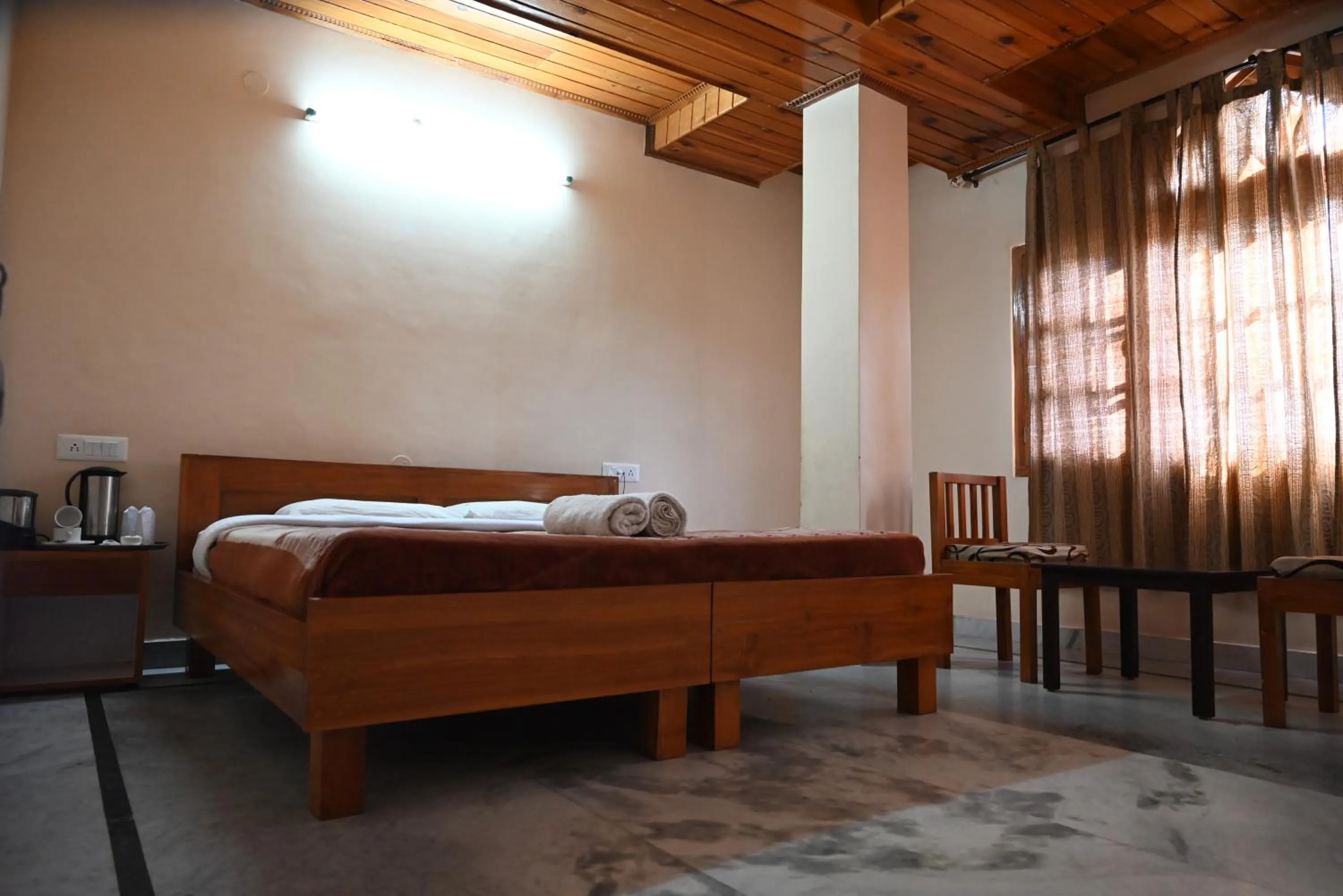 Bed in Hotel Atul Regency