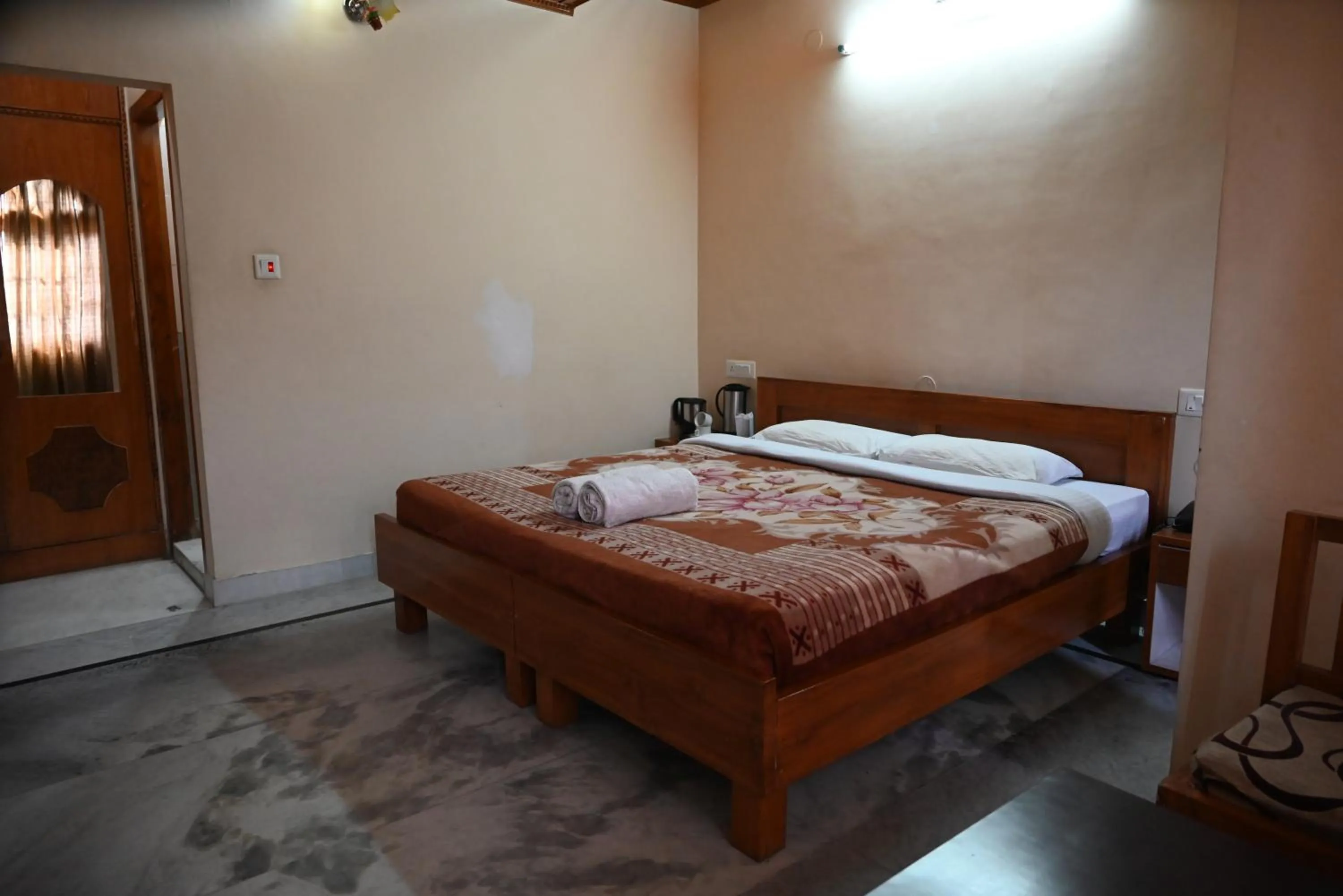 Bed in Hotel Atul Regency