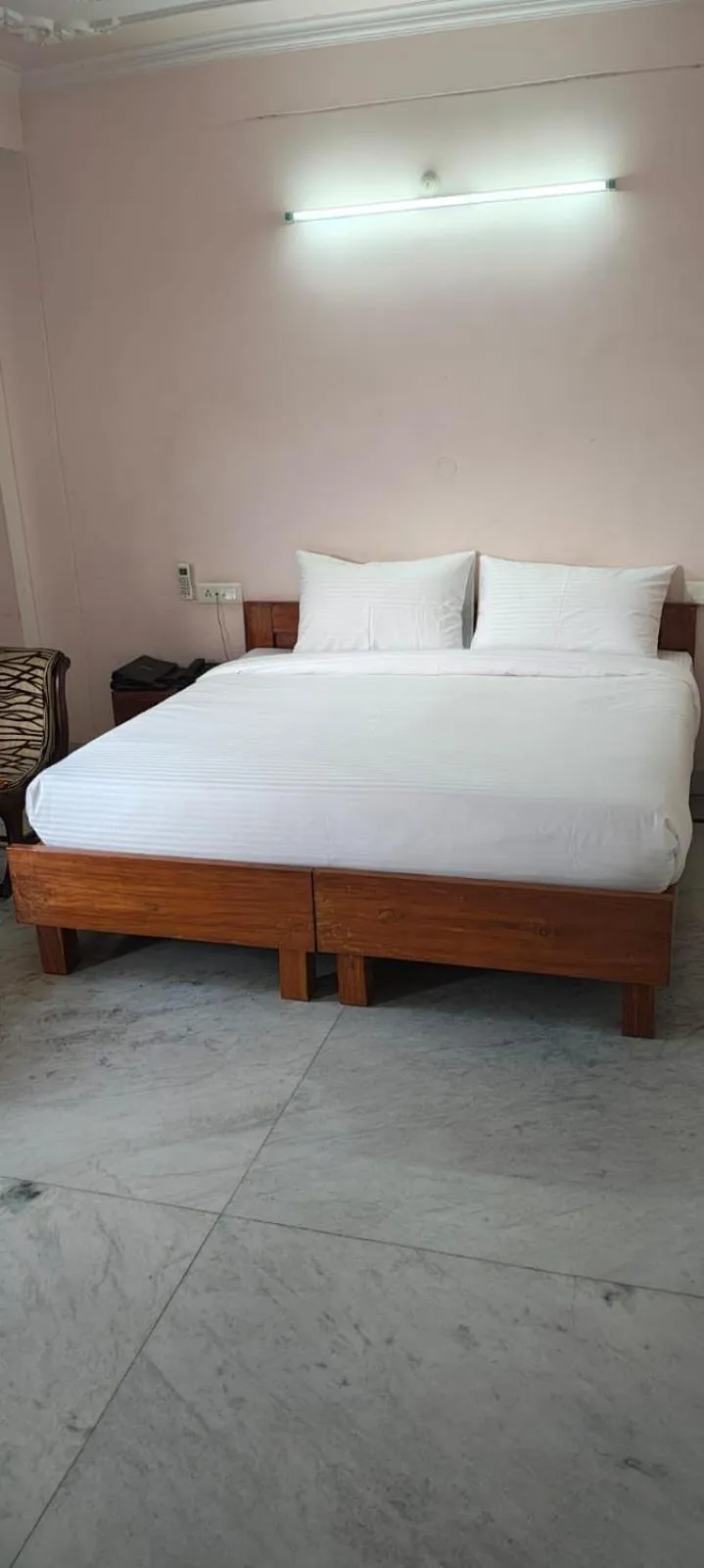 Bed in Hotel Atul Regency