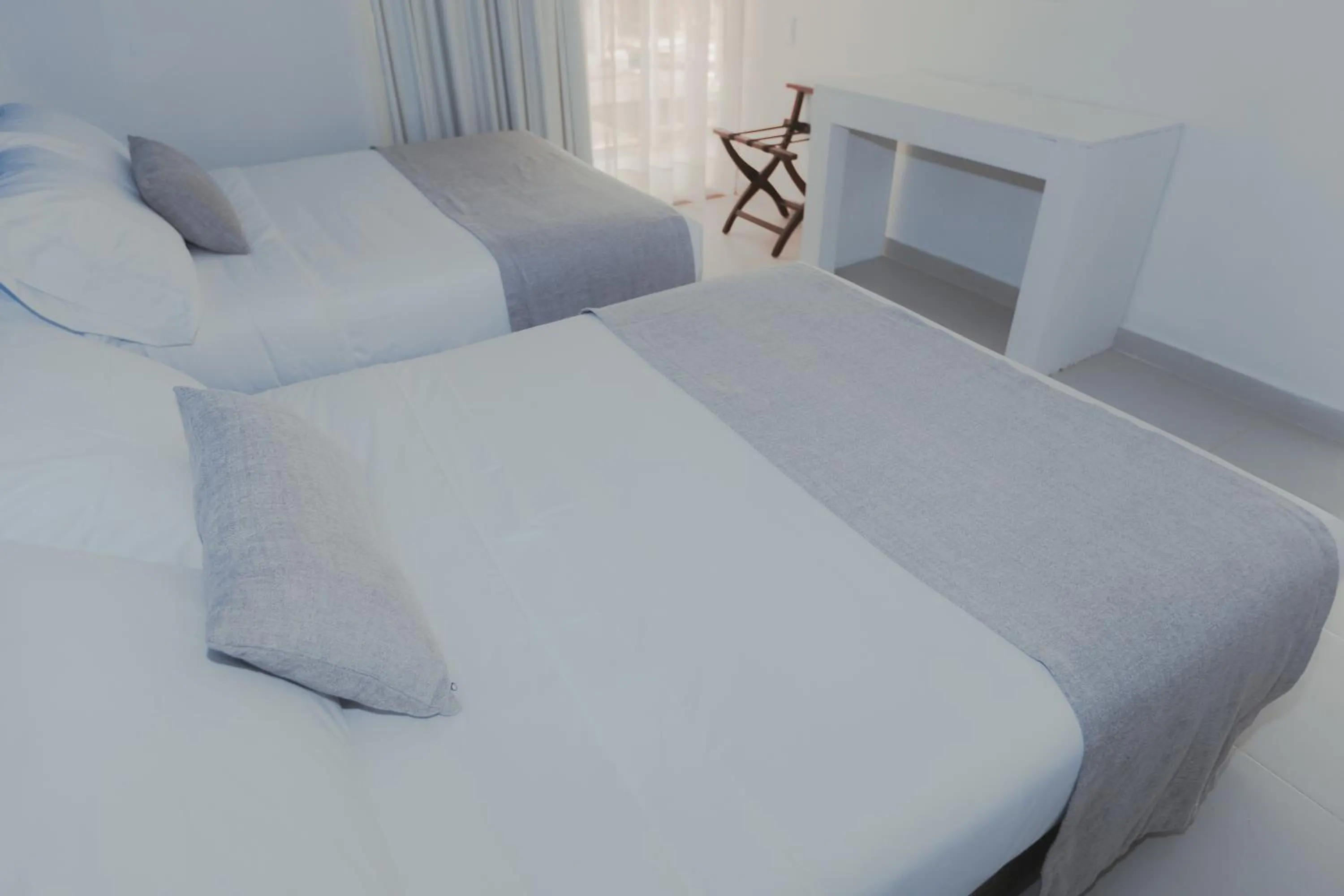 Bed in Hotel San Luis Beach House By OxoHotel