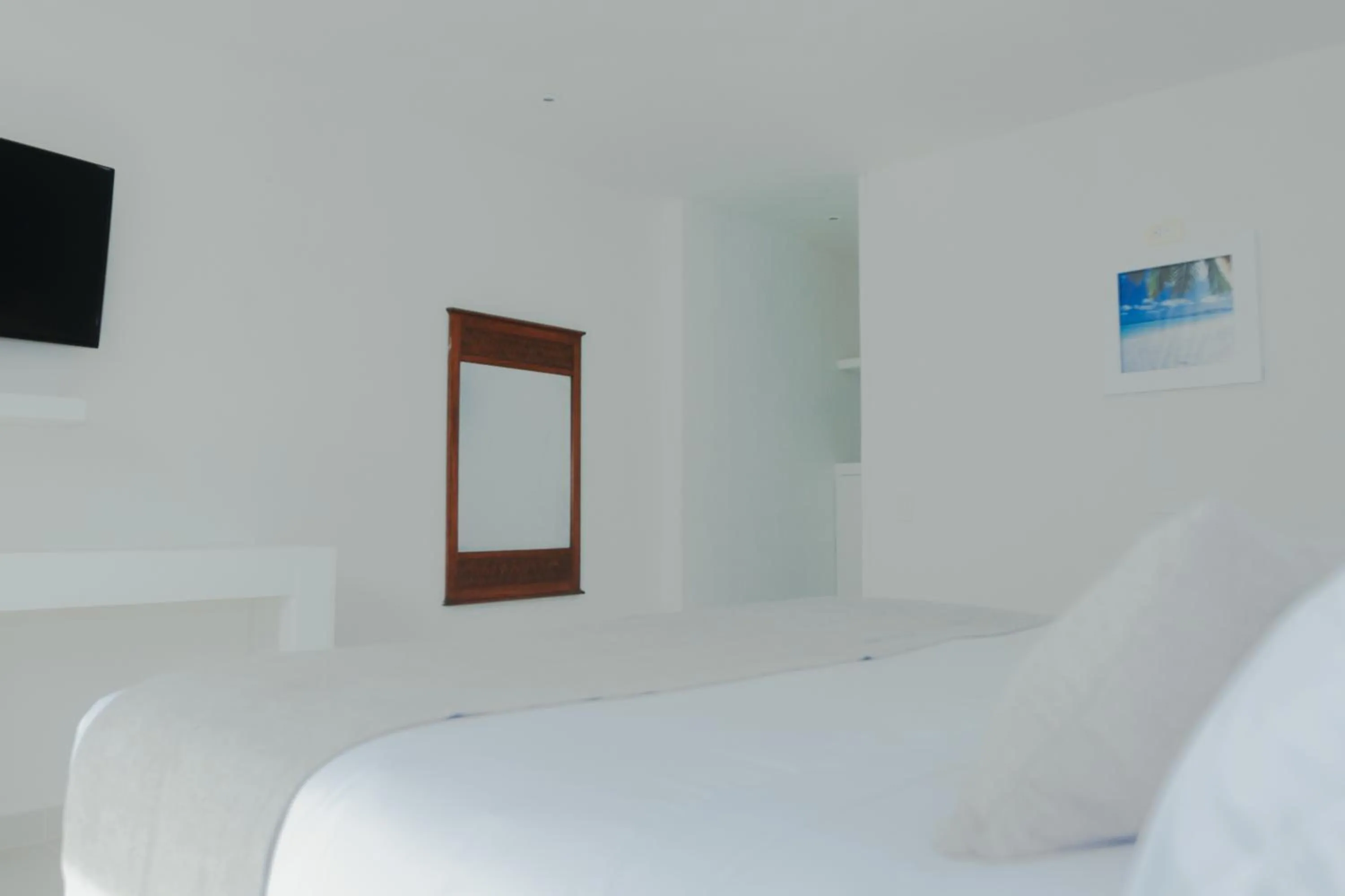 Bed in Hotel San Luis Beach House By OxoHotel