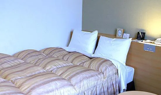 Bed in Okura Hotel Marugame