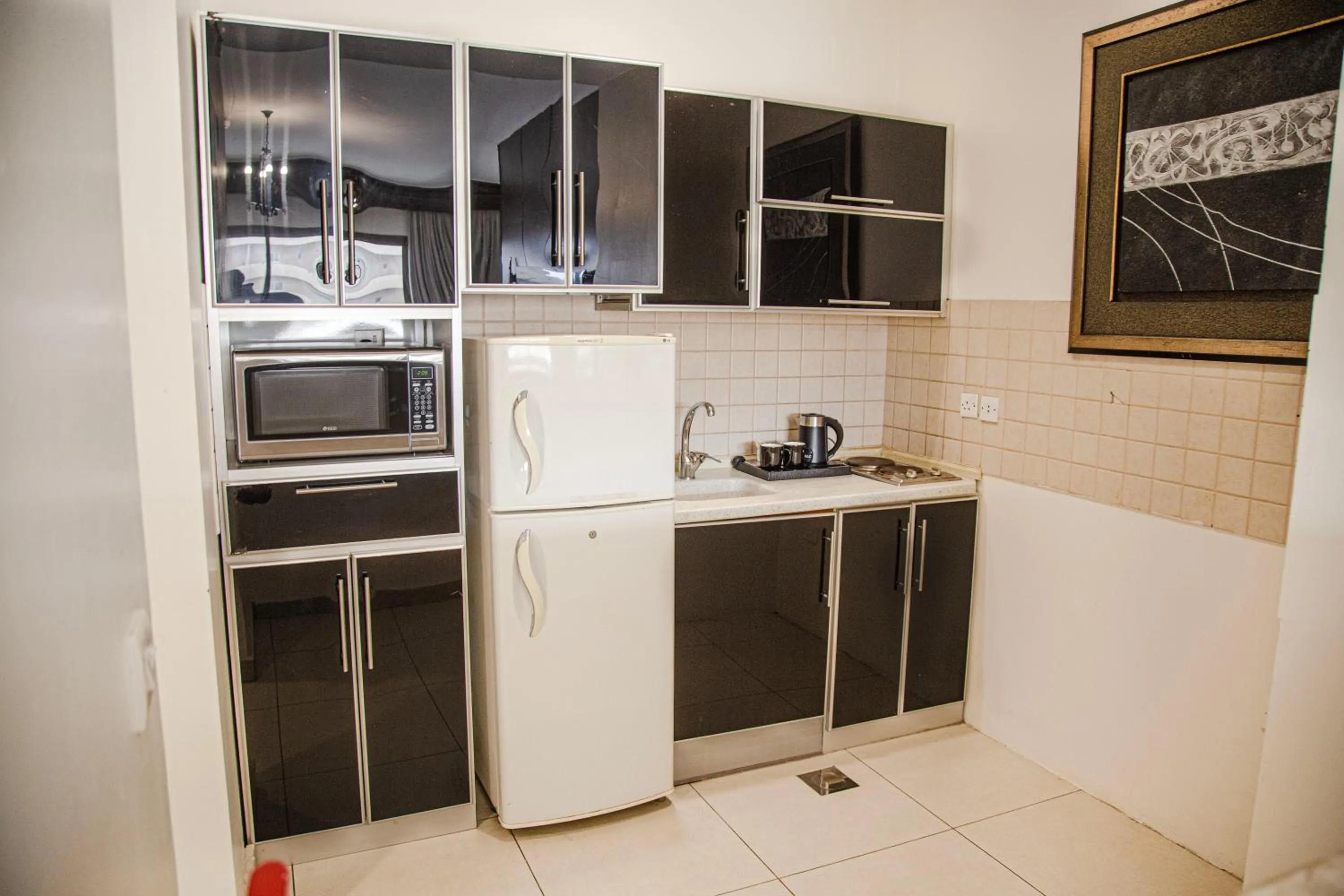 Kitchen or kitchenette in أورانس العالمية - Orans Suites