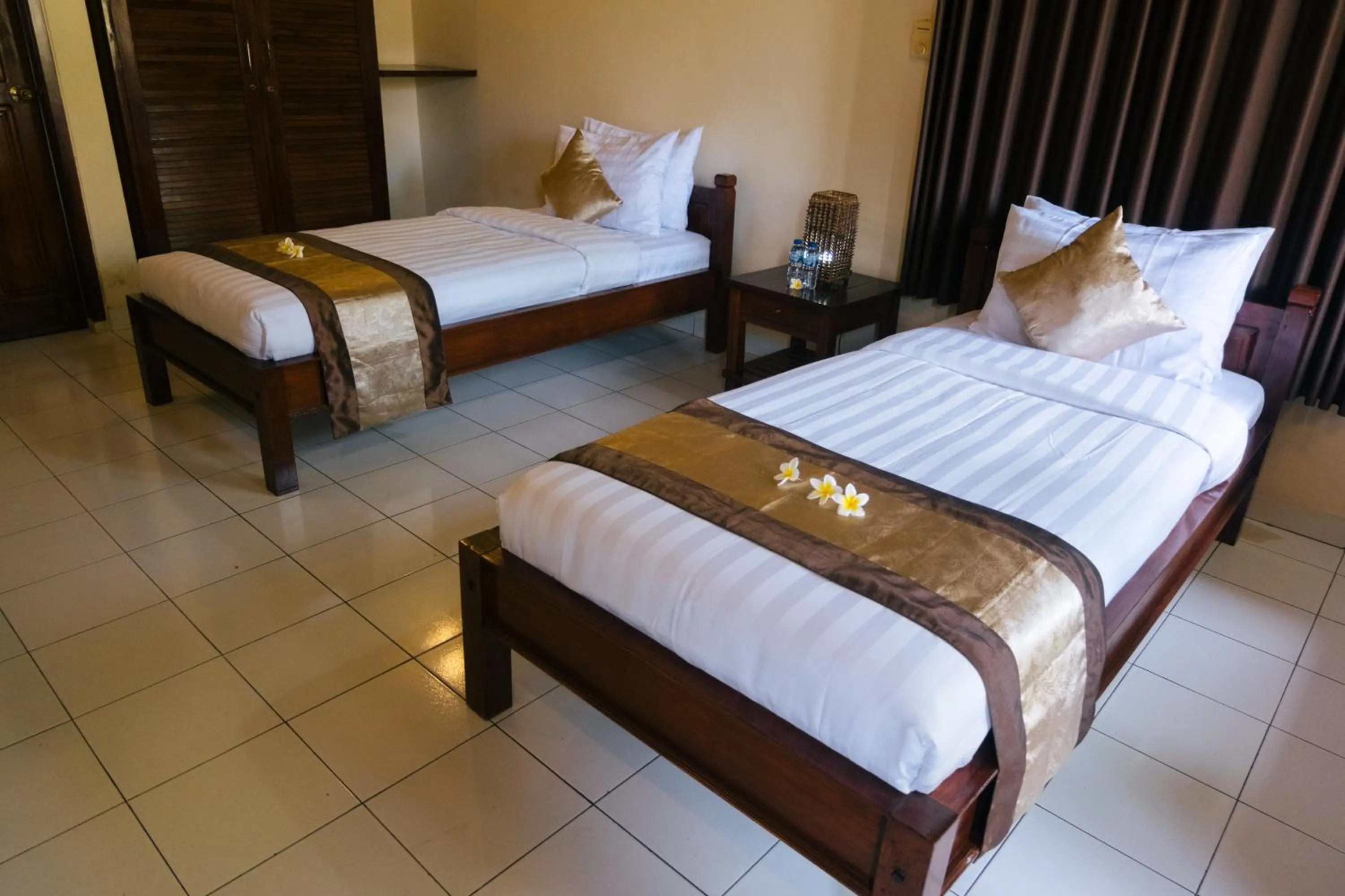 Bed in New Starlight Hotel Lovina