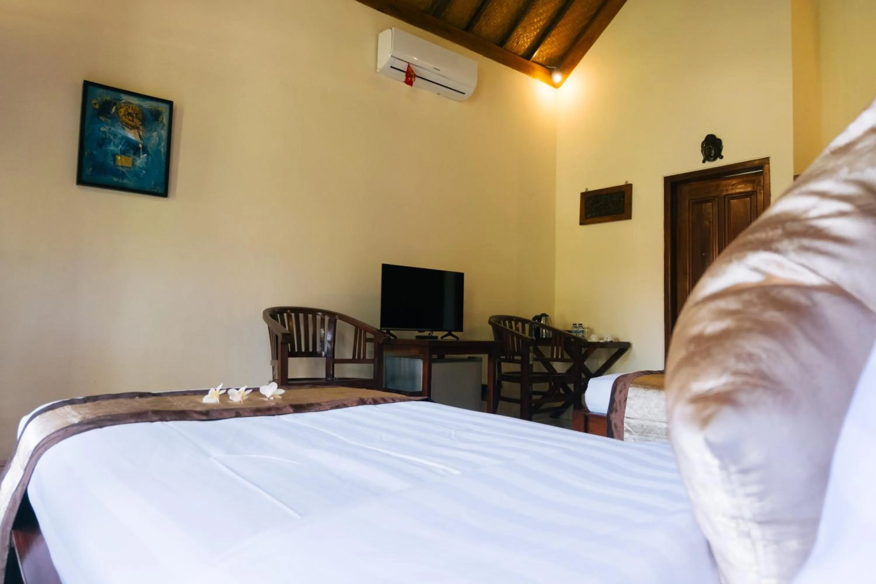 Bed in New Starlight Hotel Lovina