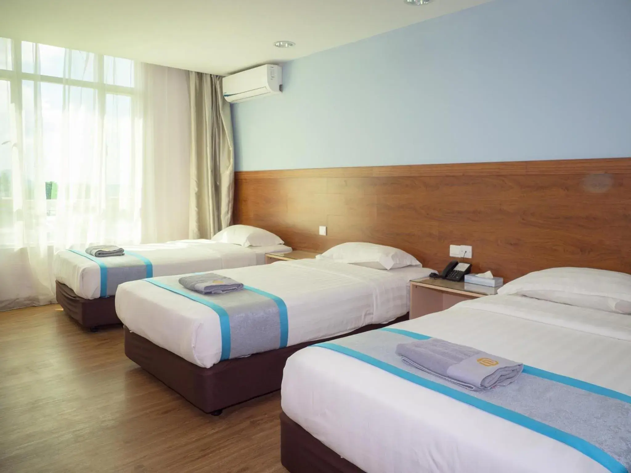 Bed in TD Mutiara Hotel Semporna