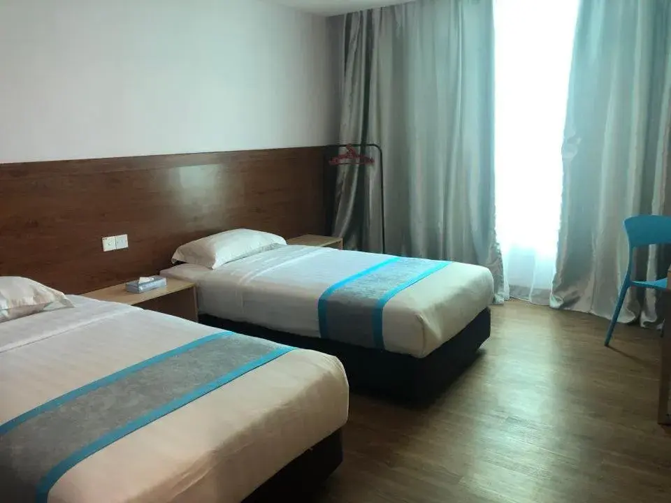Bed in TD Mutiara Hotel Semporna