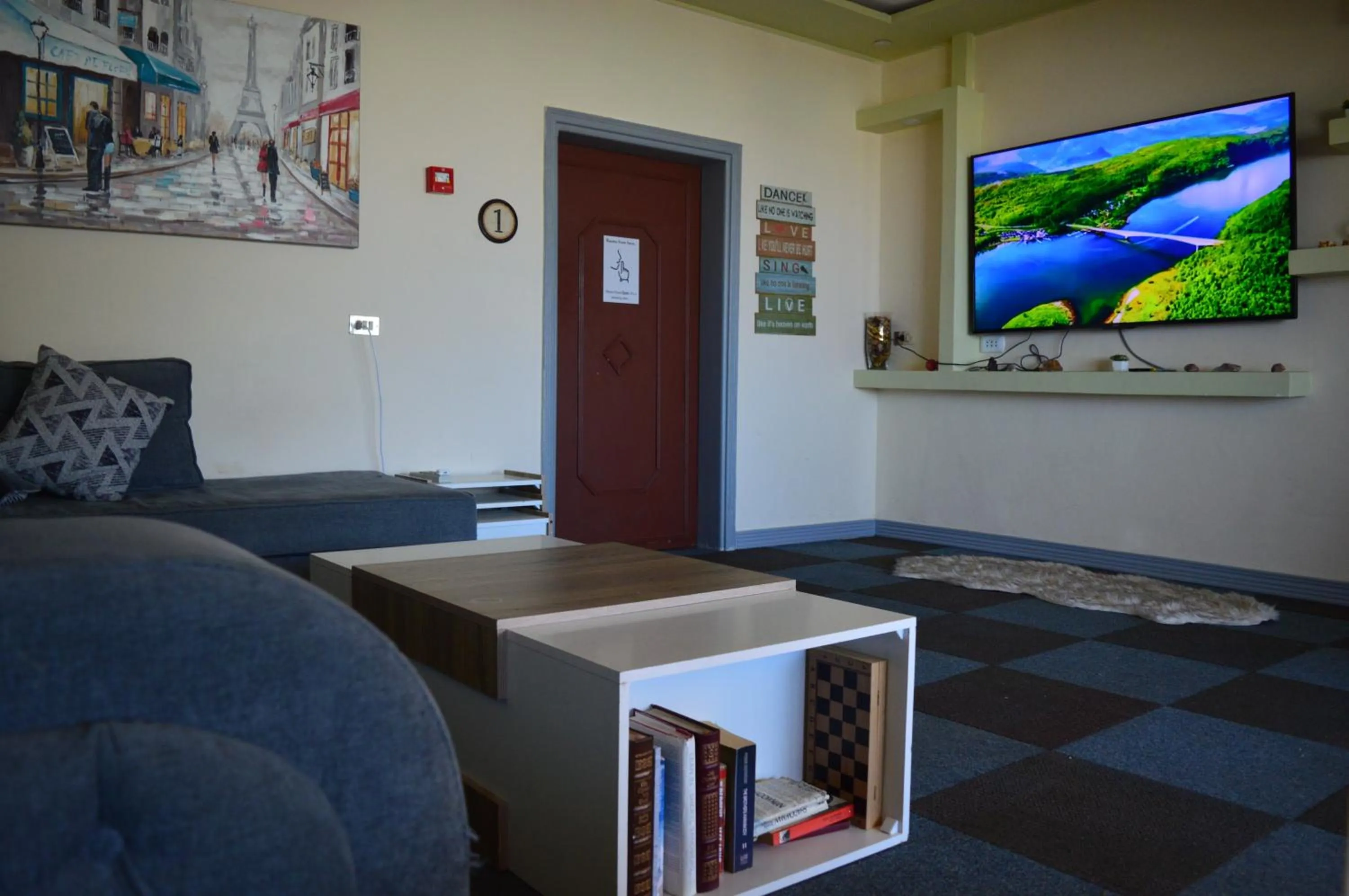 Communal lounge/ TV room in Rafiki Hostel