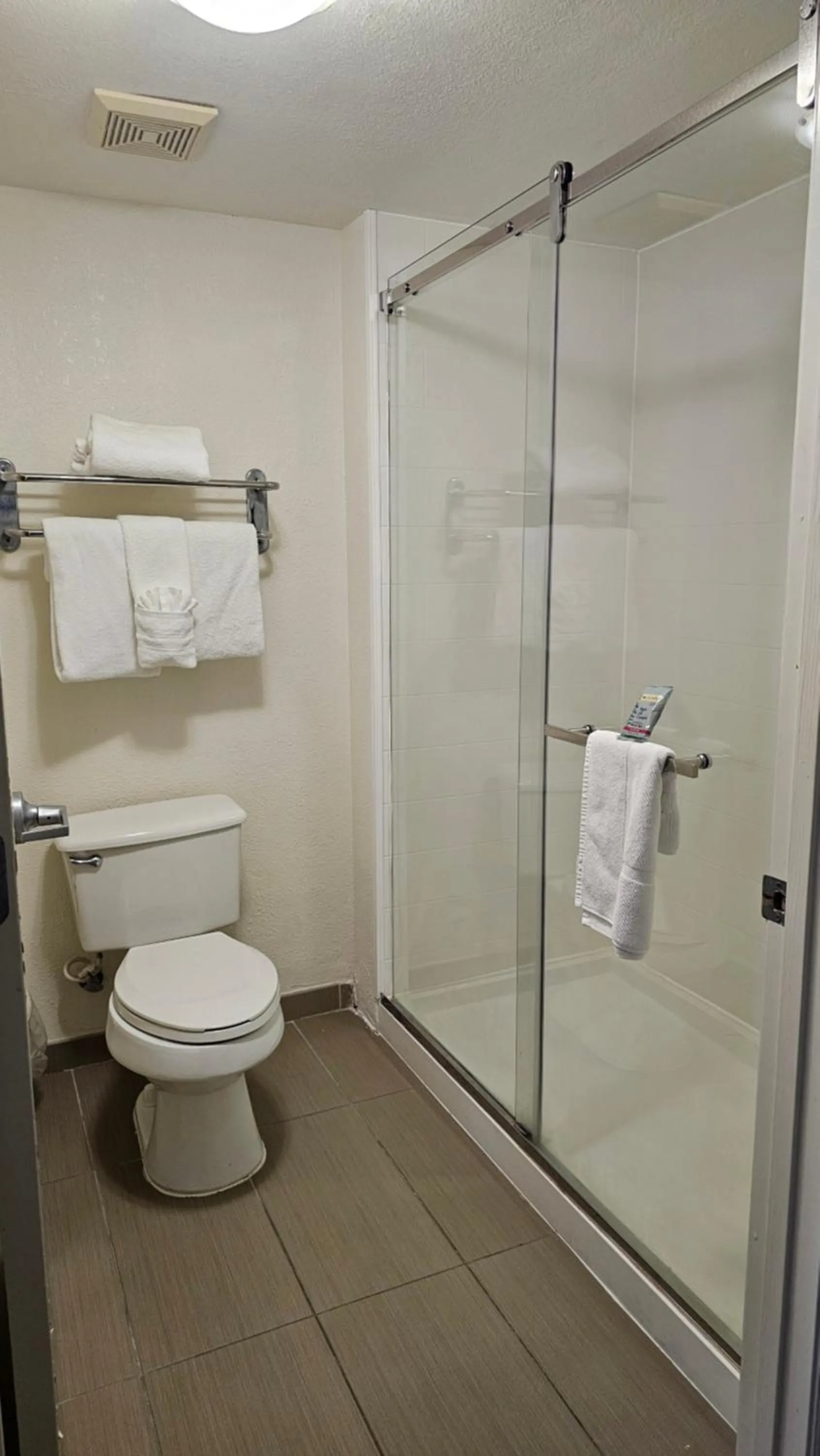 Bathroom in SureStay Plus by Best Western Orlando Lake Buena Vista