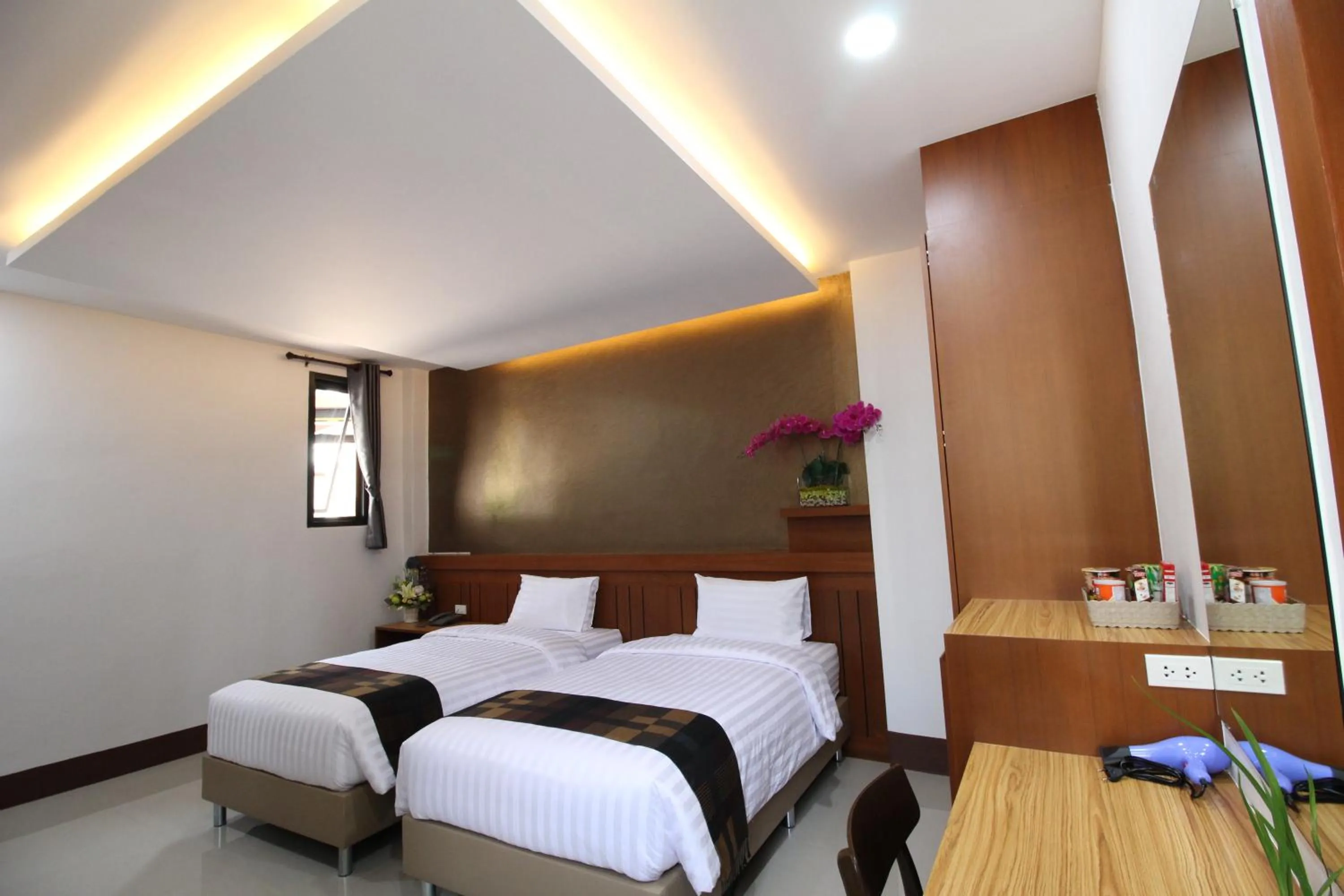 Bed in Nonghan Grand Hotel and Resort