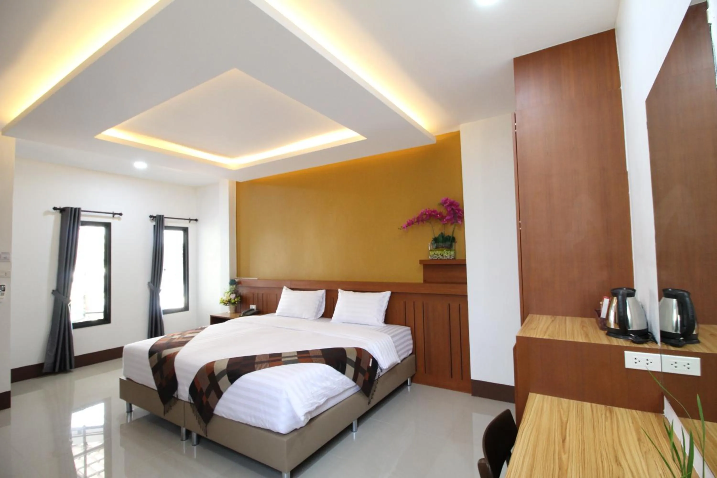 Bed in Nonghan Grand Hotel and Resort