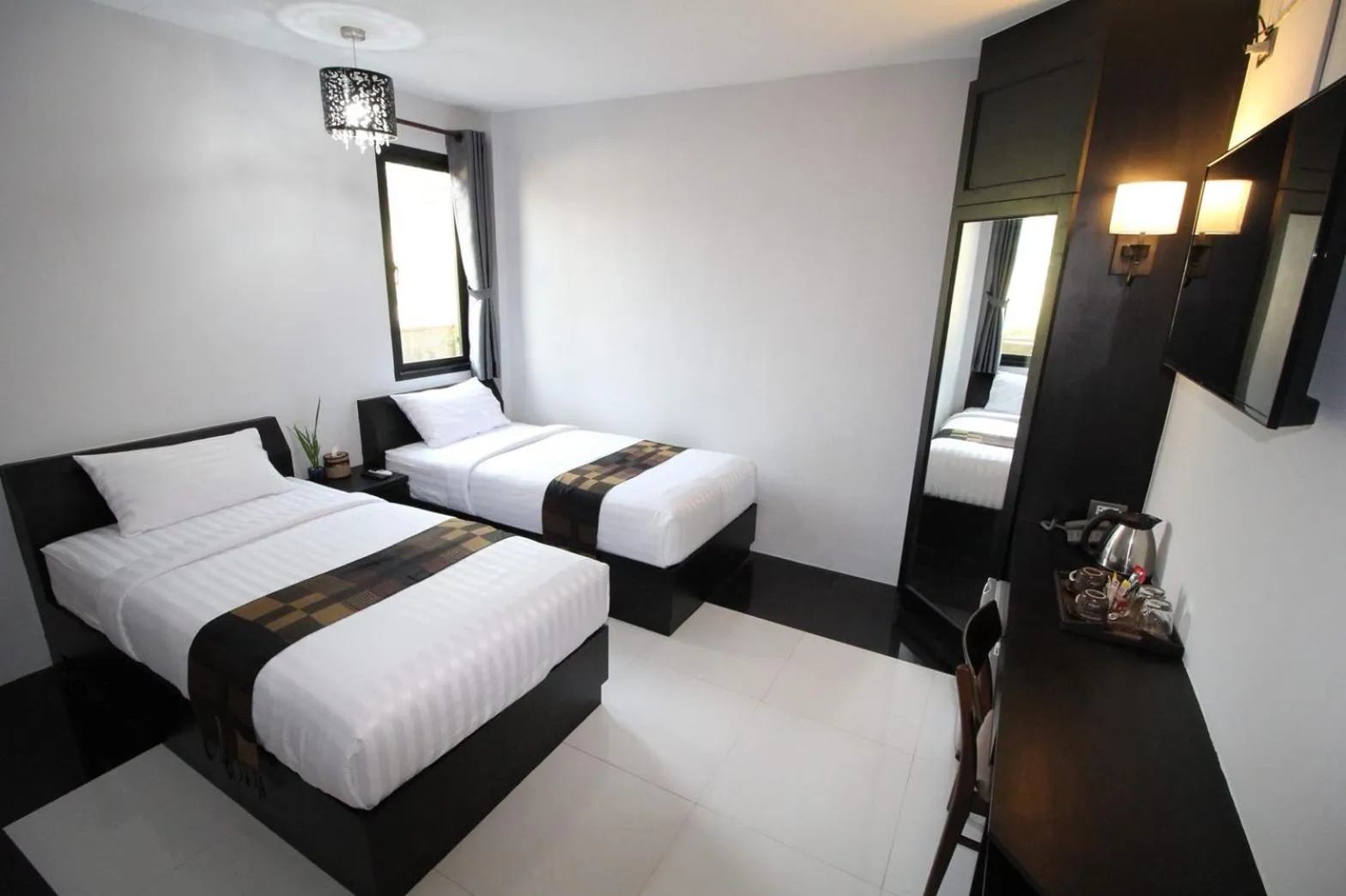 Bed in Nonghan Grand Hotel and Resort