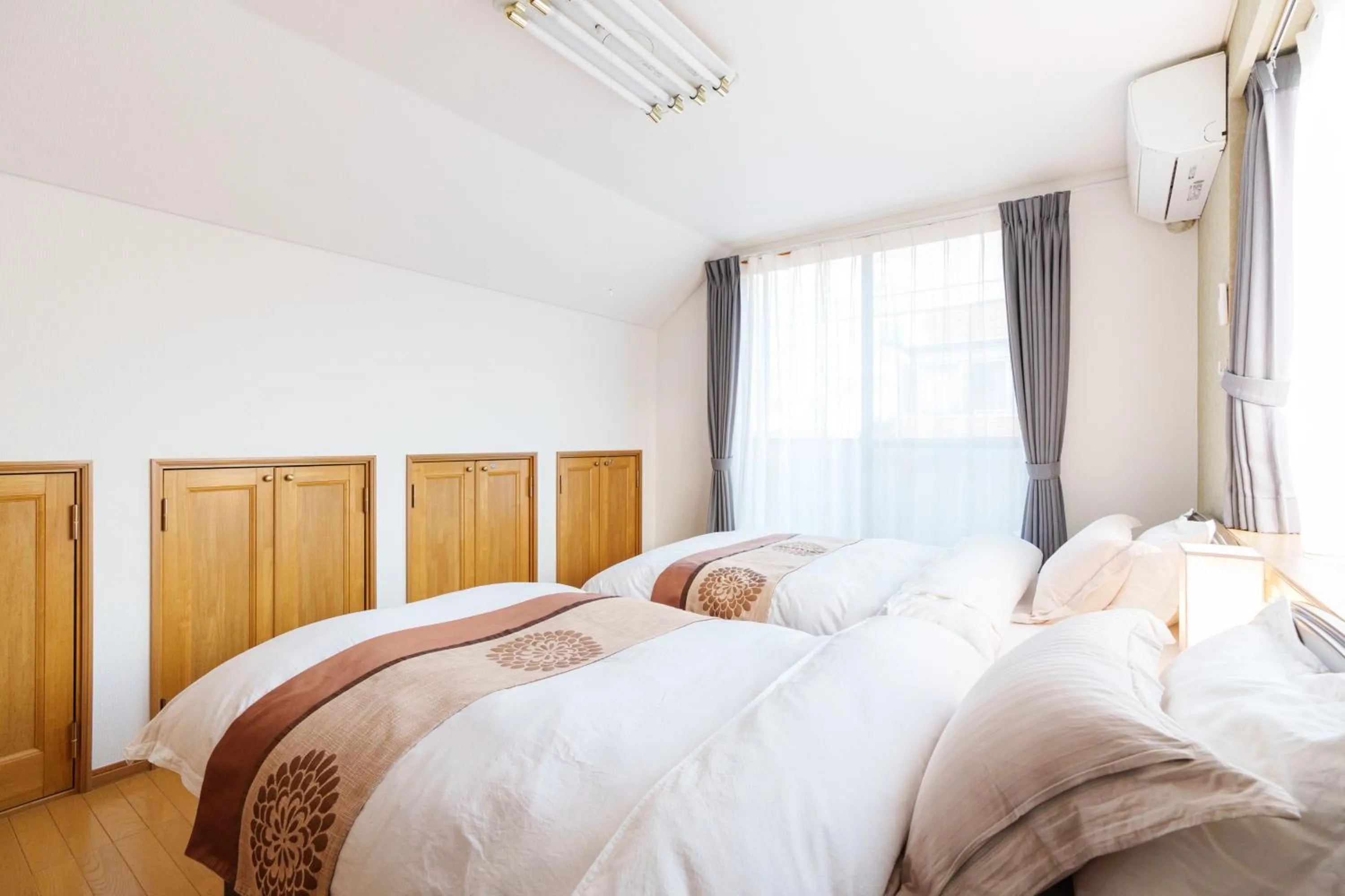 Bedroom, Bed in Luxury Guest House in Tokyo Shinjuku