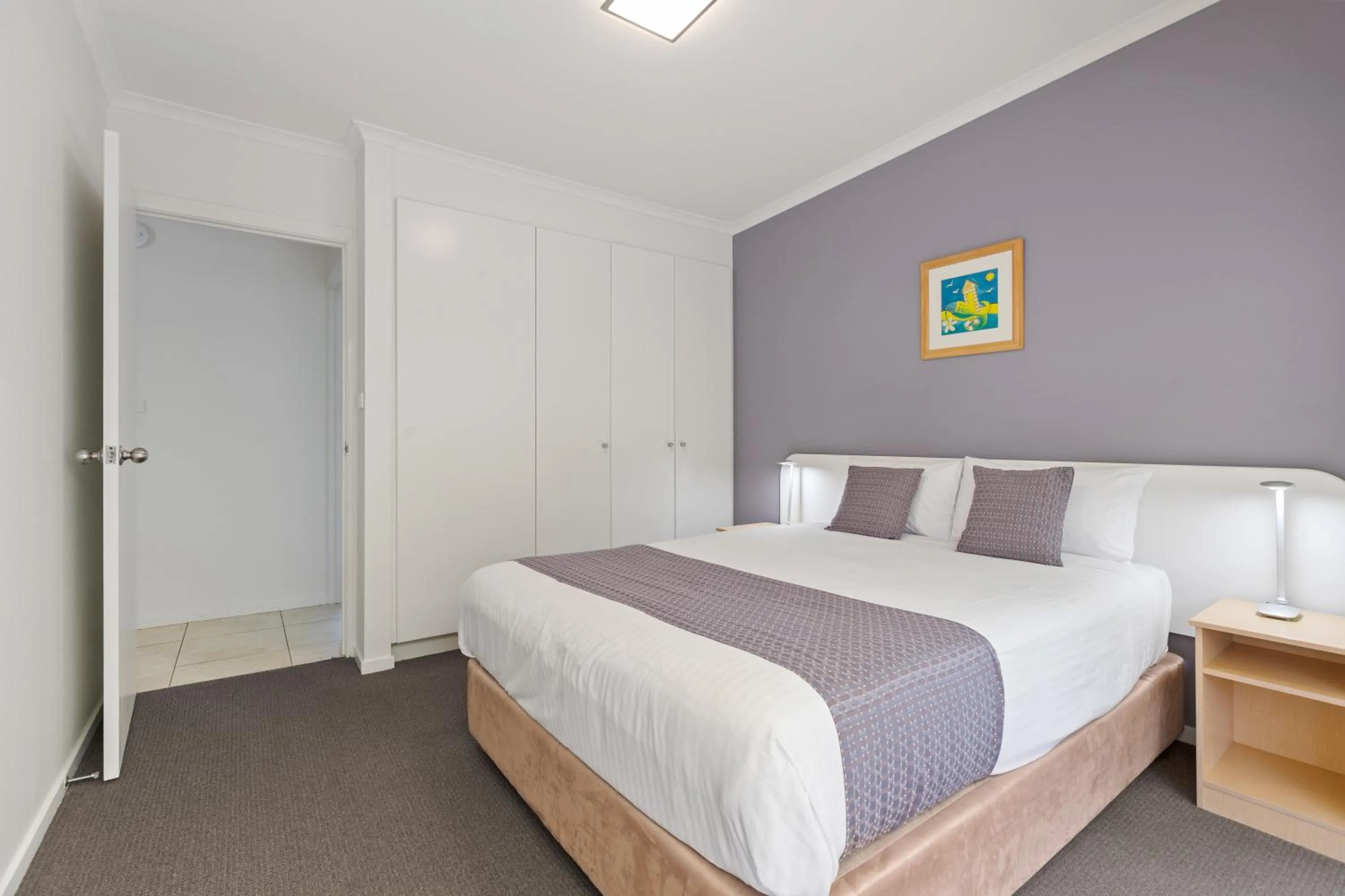 Bed in Tathra Beach House Holiday Apartments