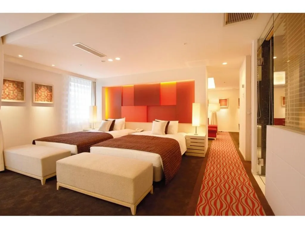 Bed in Kokusai 21 International Hotel