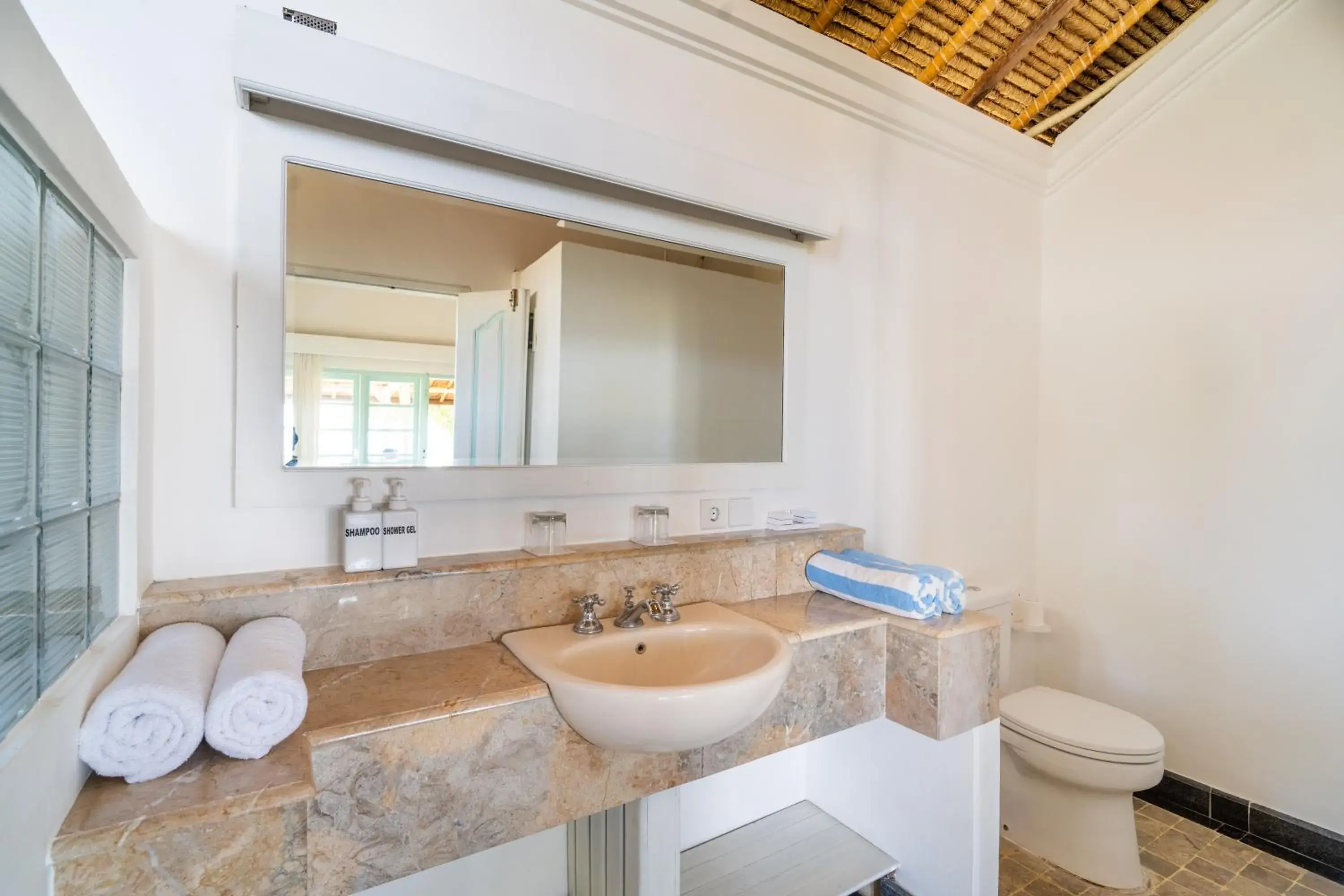 Bathroom in Scuba Seraya Resort Bathroom in Scuba Seraya Resort