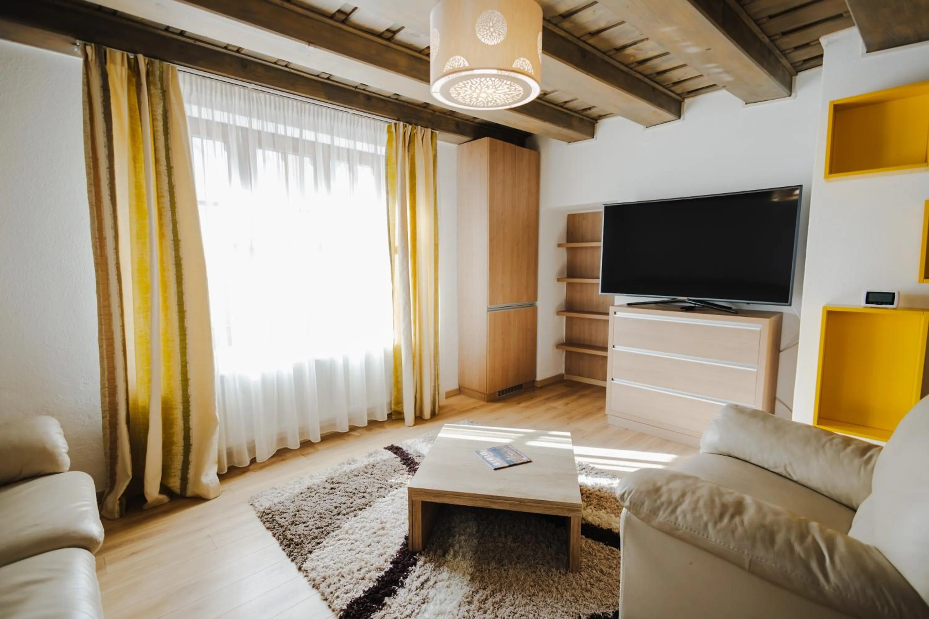 Communal lounge/ TV room in Casa Nicolae Luxury Suites