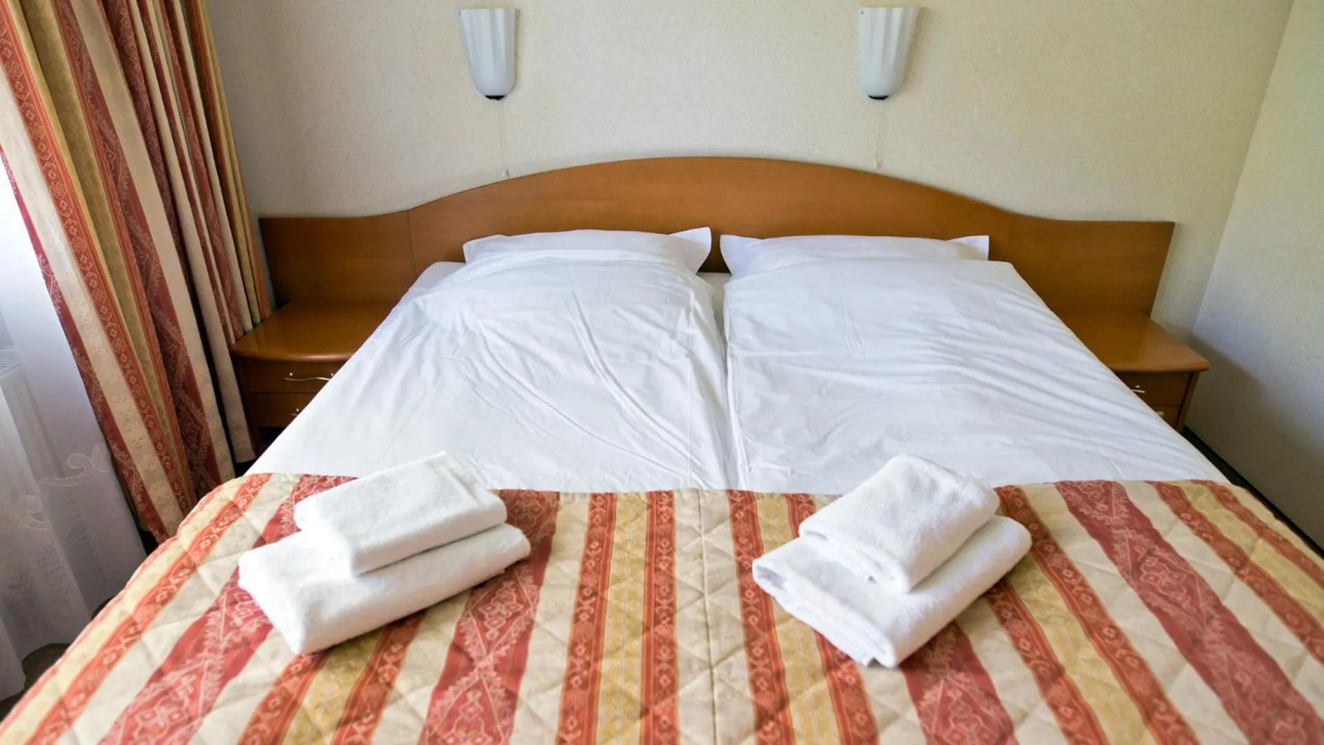 Bed in Hotel Kama Park