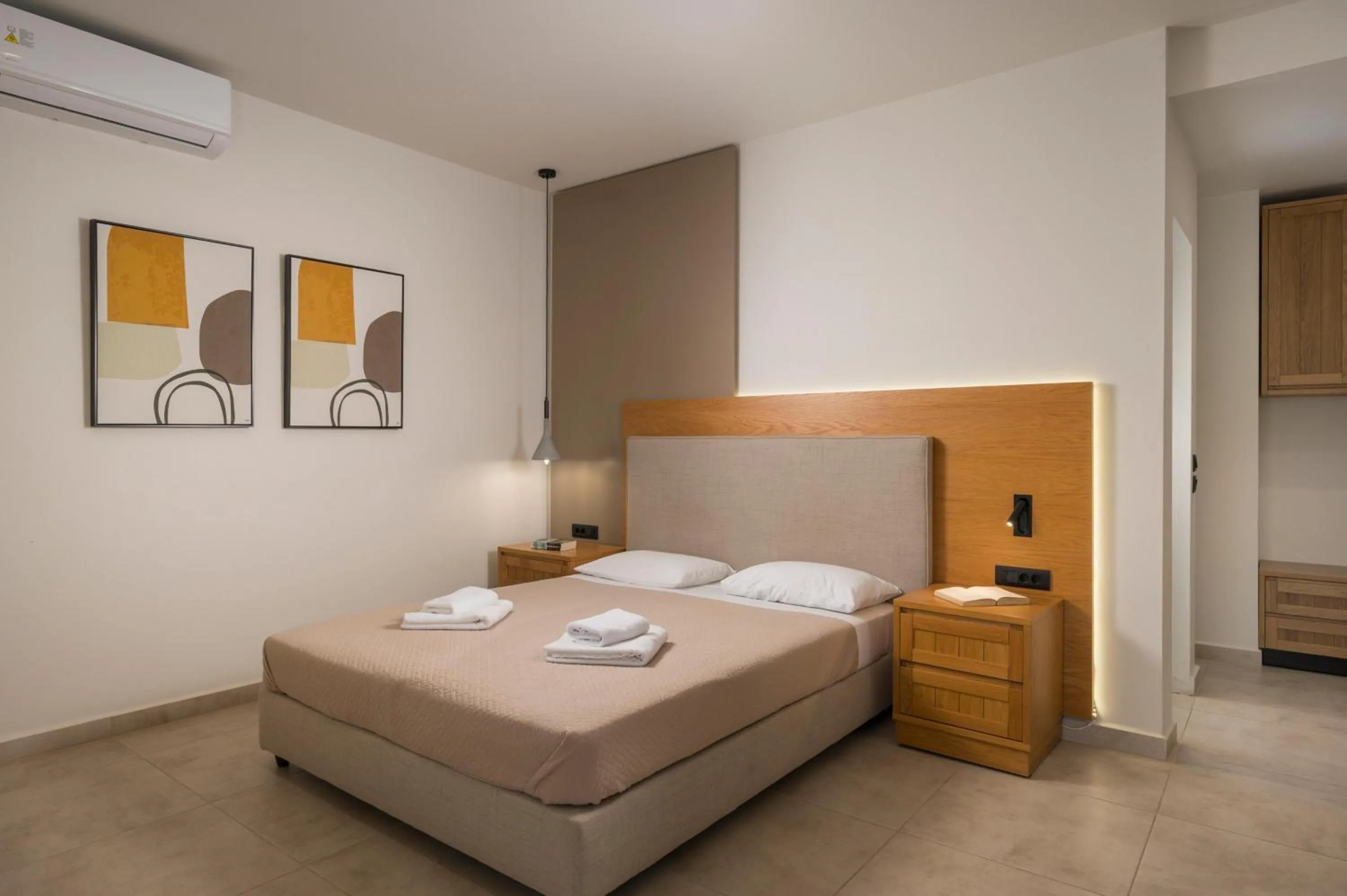 Bed in Petritos Rooms and Studios