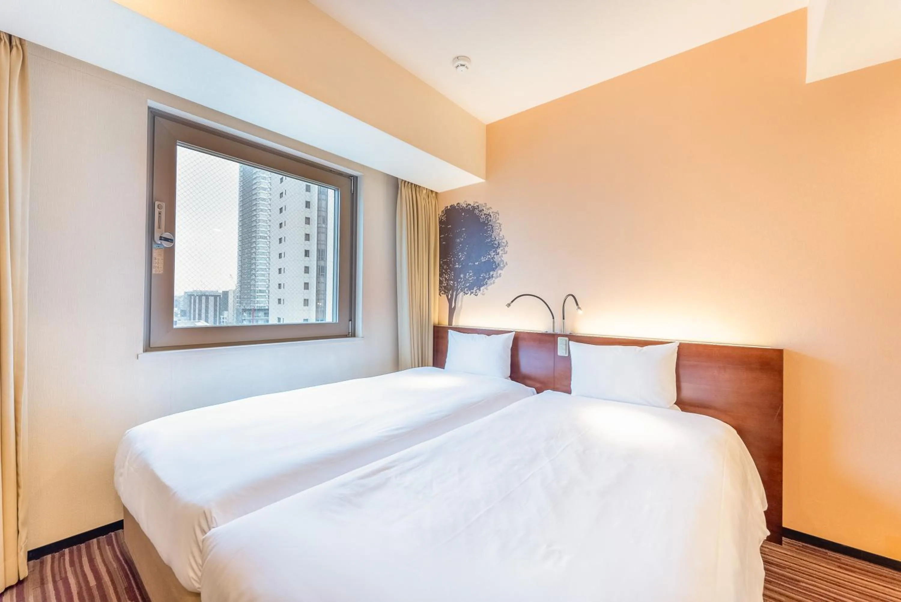 Bed in Hotel Keihan Asakusa