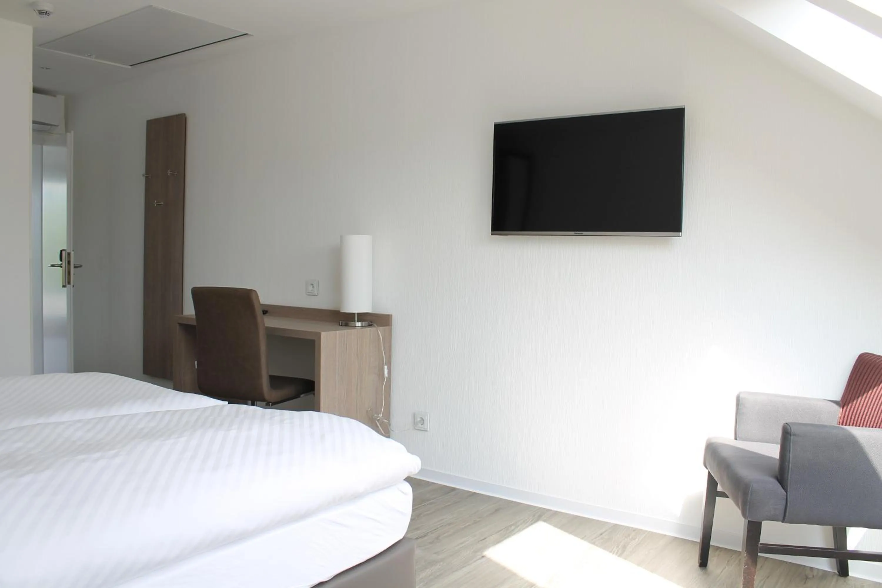 Seating area, Bed in RheinHotel ARTE