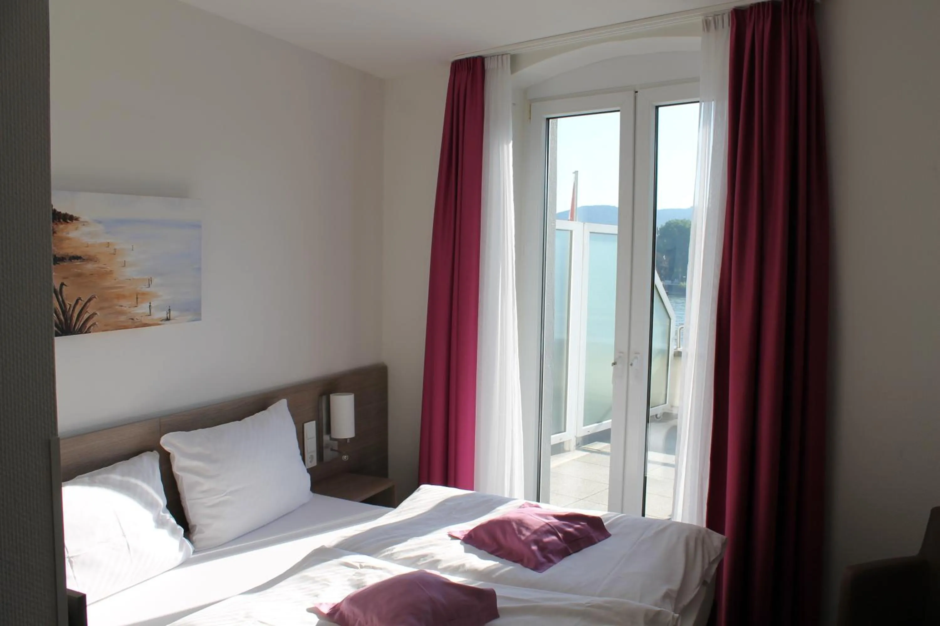 Photo of the whole room, Bed in RheinHotel ARTE