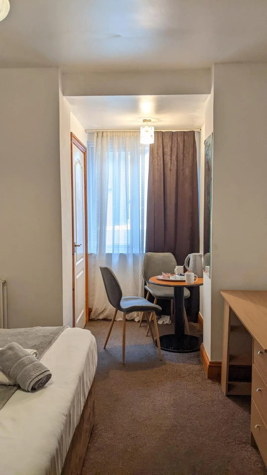 Bed in Old Palace Guest House