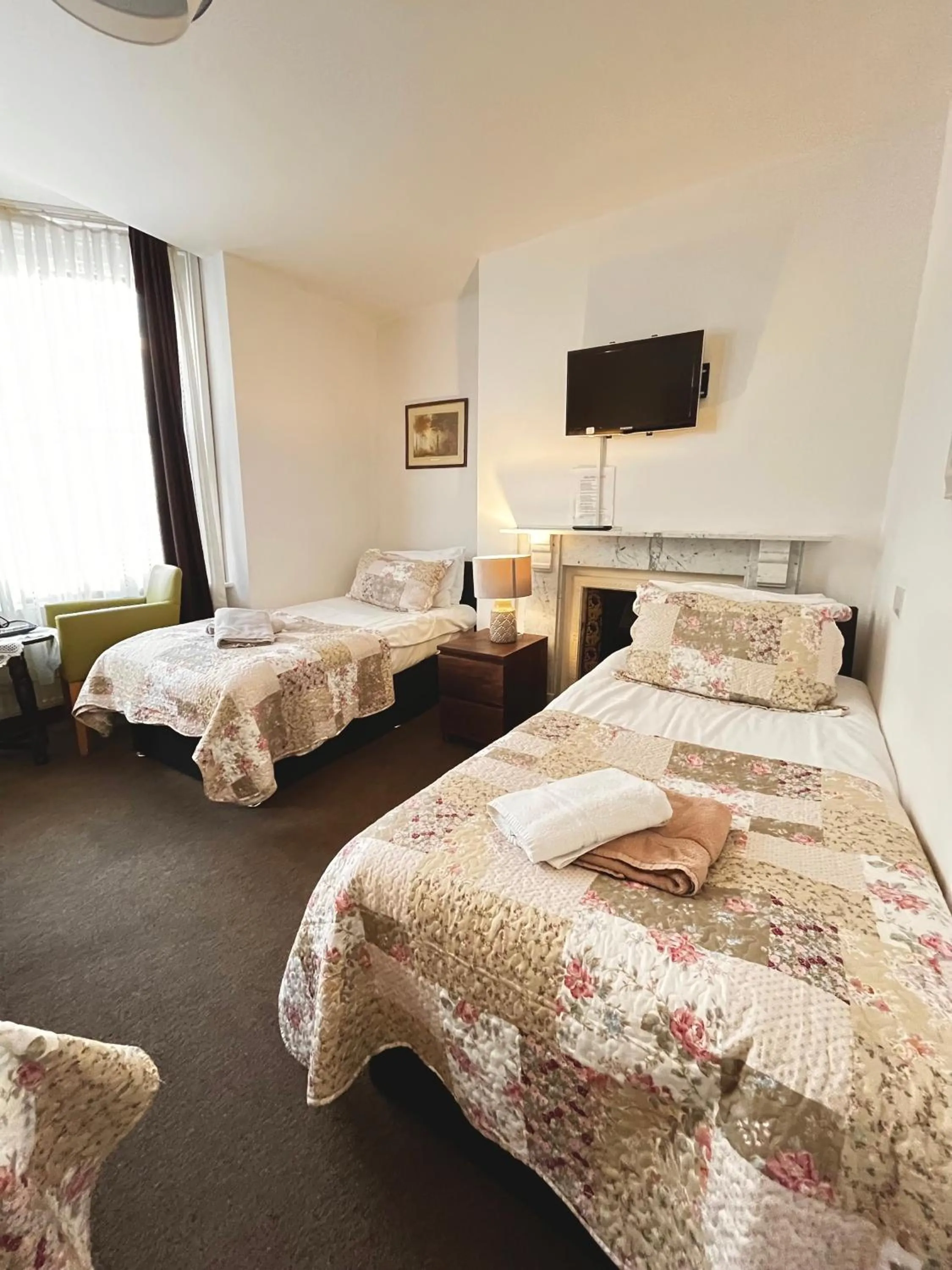 Bed in Old Palace Guest House