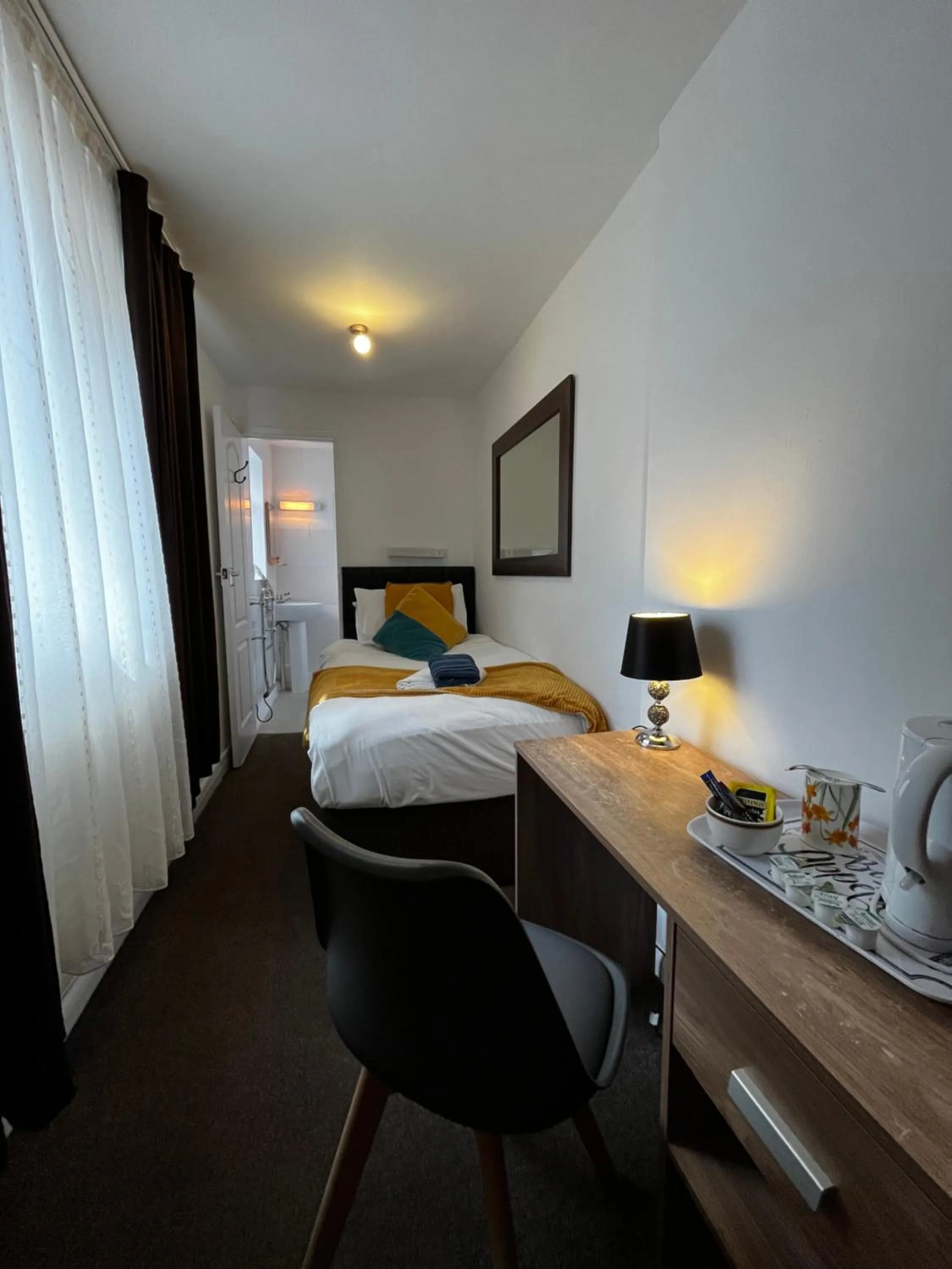 Bed in Old Palace Guest House